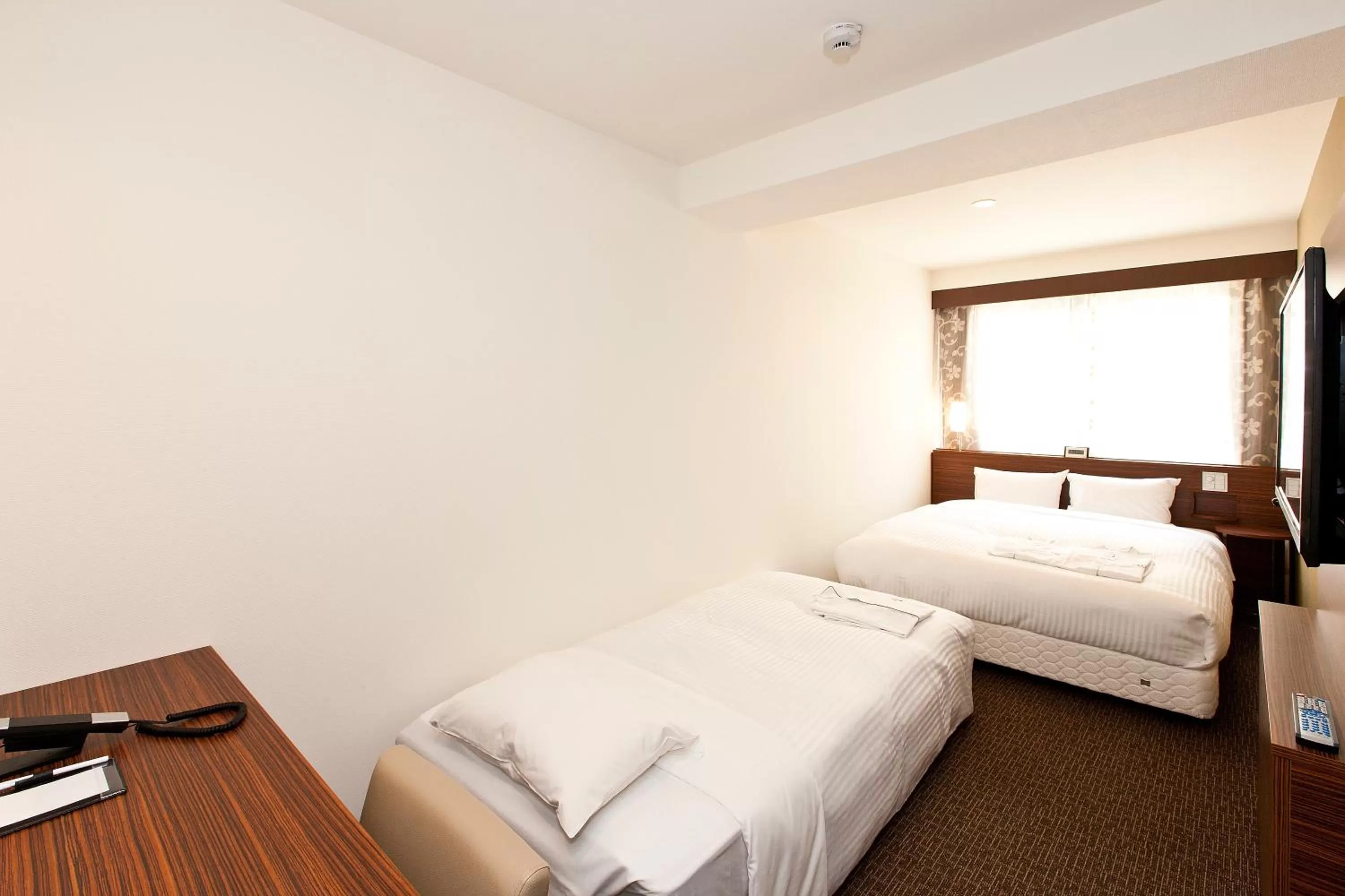 Bed in Sotetsu Fresa Inn Tokyo Tamachi