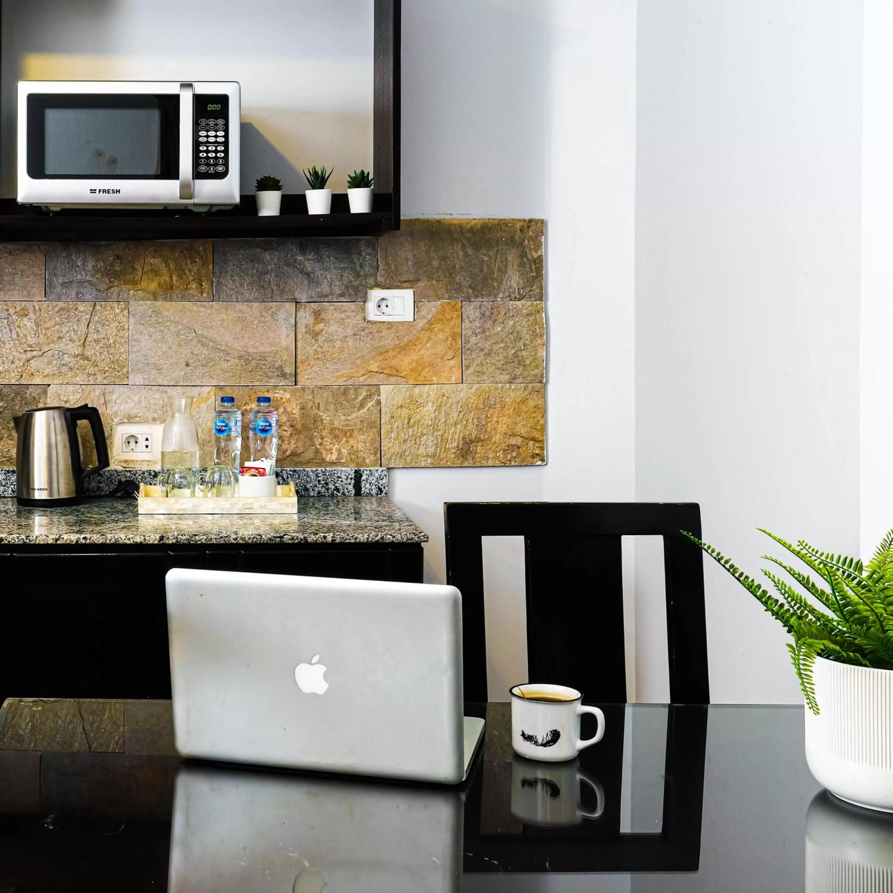 Kitchen or kitchenette in NewCity Hotel & Suites