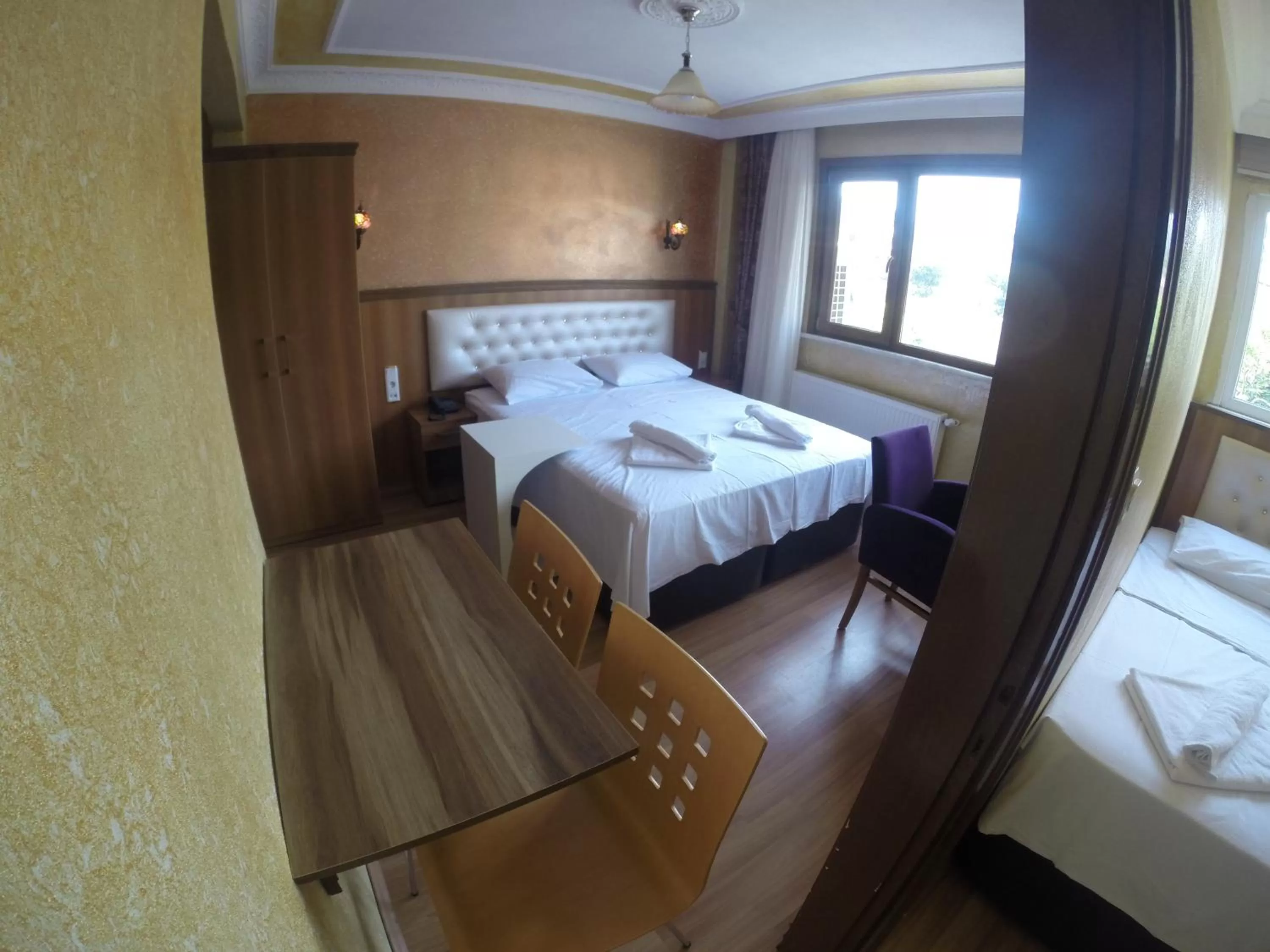 Seating area, Bed in Arat Apartments