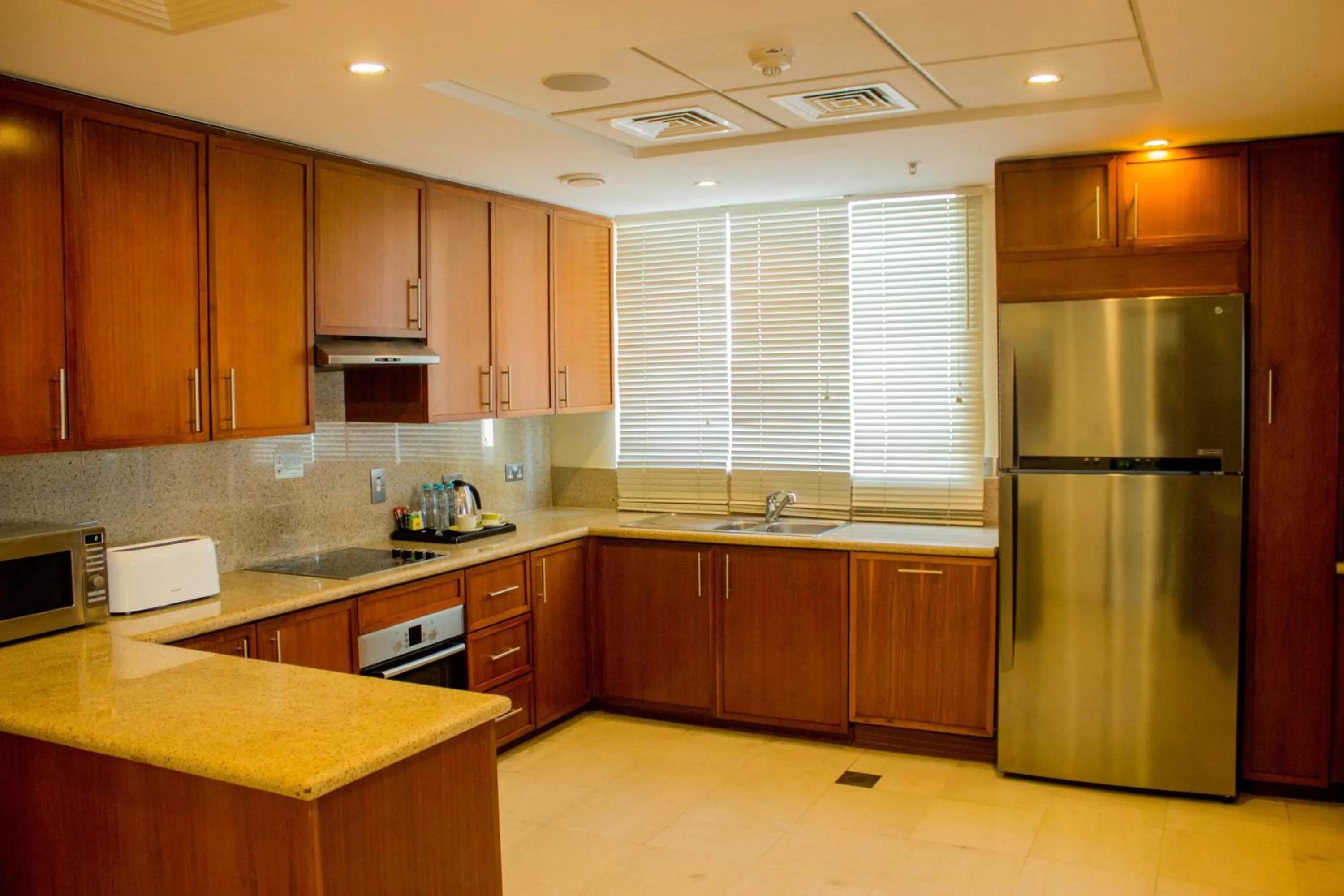 Kitchen or kitchenette in Ramada by Wyndham Downtown Dubai