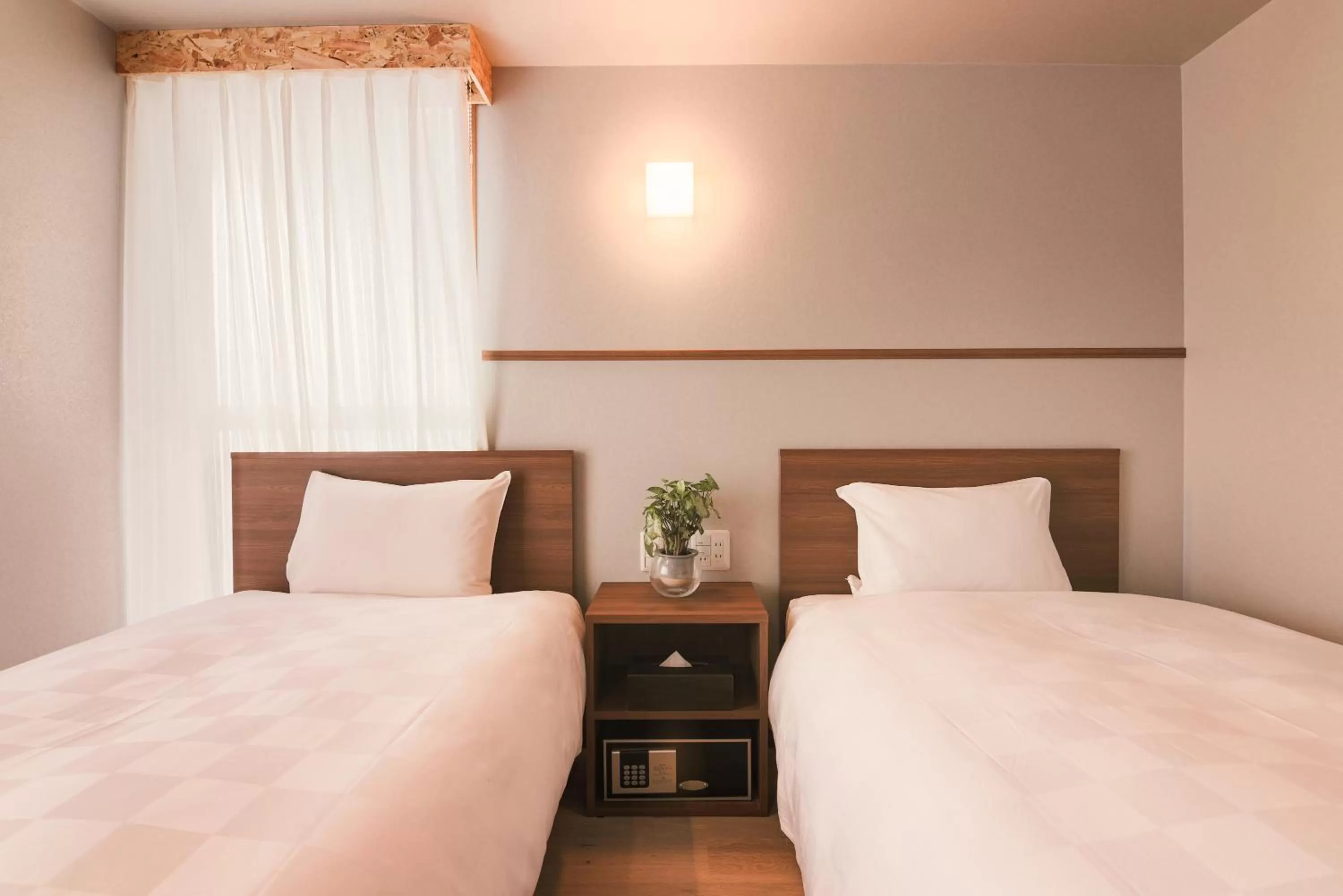 Bed in WAYFARER Kyoto Shijo