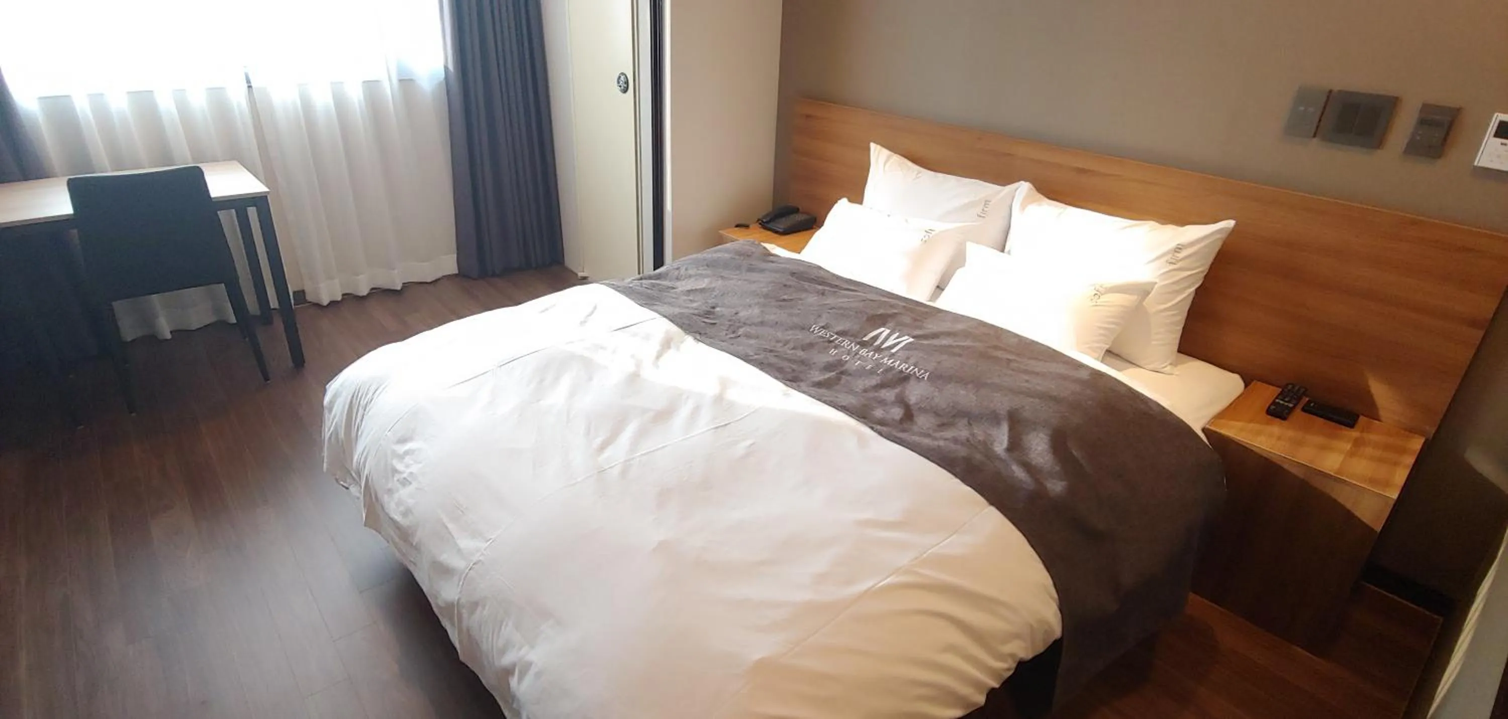 Bed in Western Bay Marina Hotel