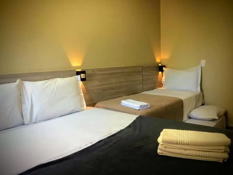 Bed in Pousada Tissiano