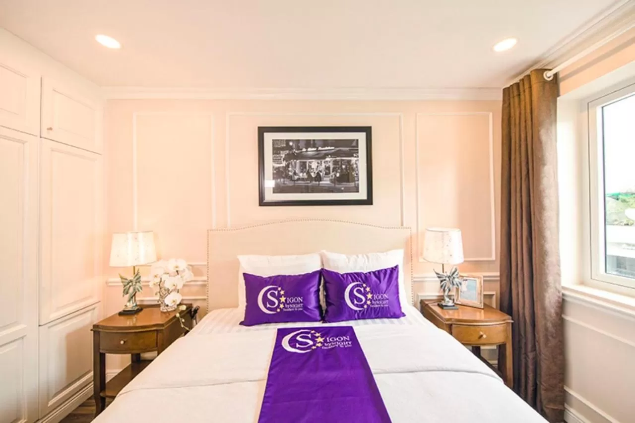 Bed in Saigon By Night Luxury Hotel