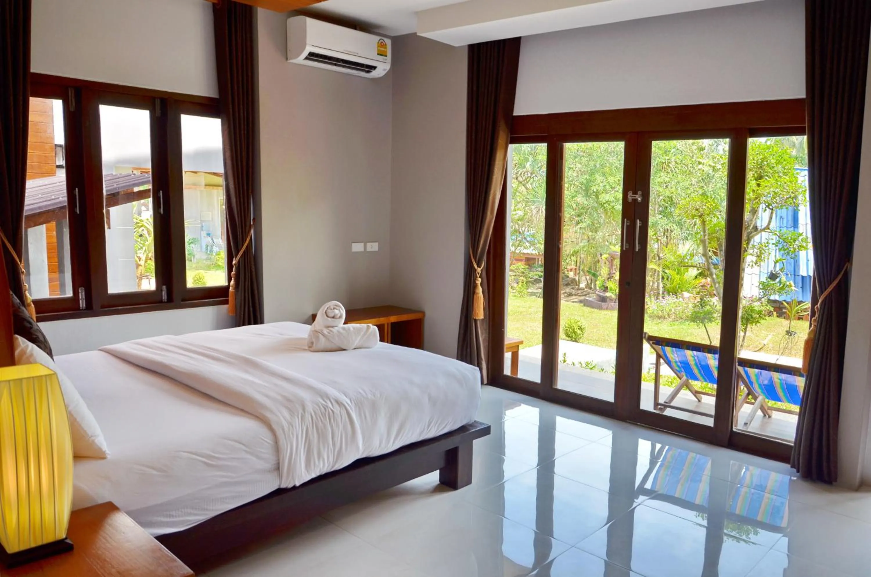 Photo of the whole room, Bed in Lanta Intanin Resort - SHA Extra Plus