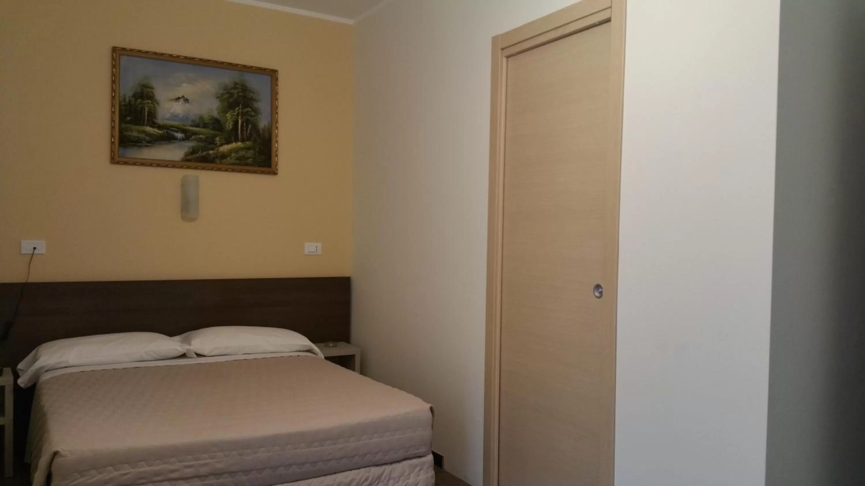 Bed in Hotel Tommaseo