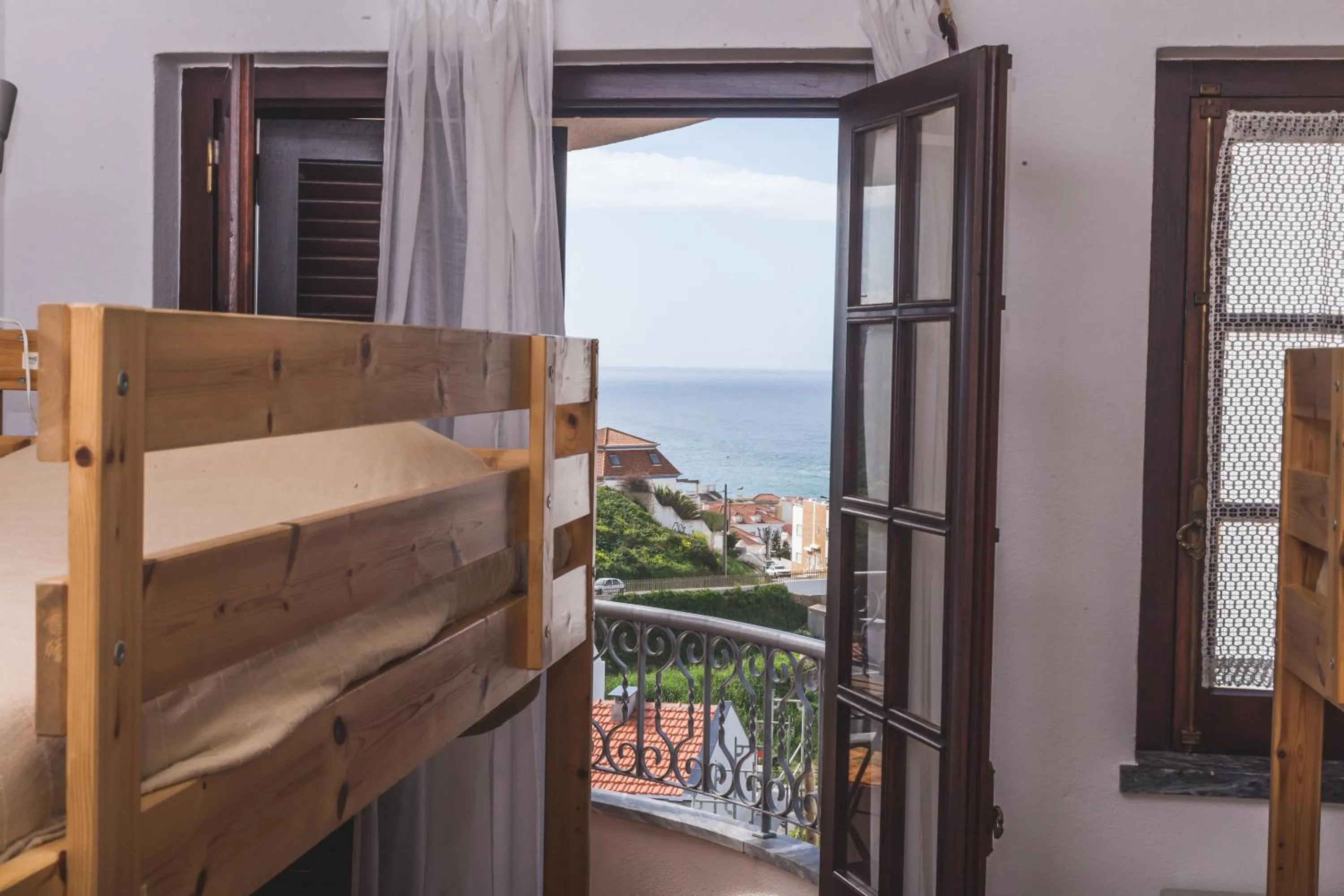 Balcony/Terrace, Bed in Ericeira Chill Hill Hostel & Private Rooms - Peach Garden