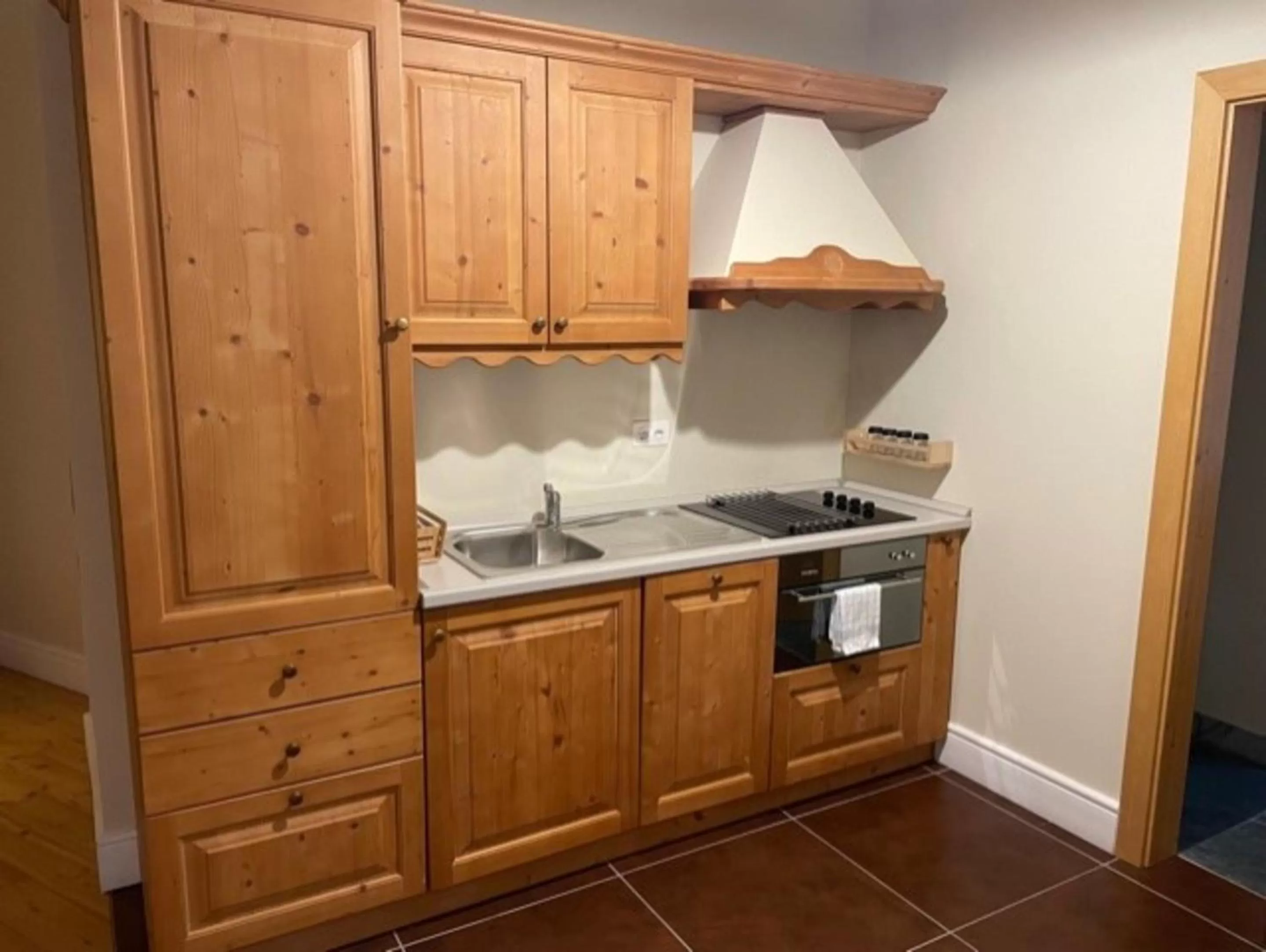 Kitchen or kitchenette in Hotel Bernina 1865 by Kleos Group Collection