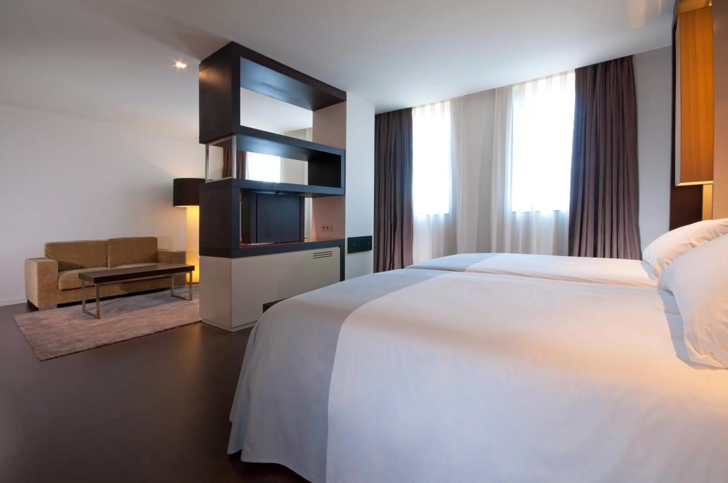 Living room, Bed in Hotel Barcelona Condal Mar Affiliated by Meliá