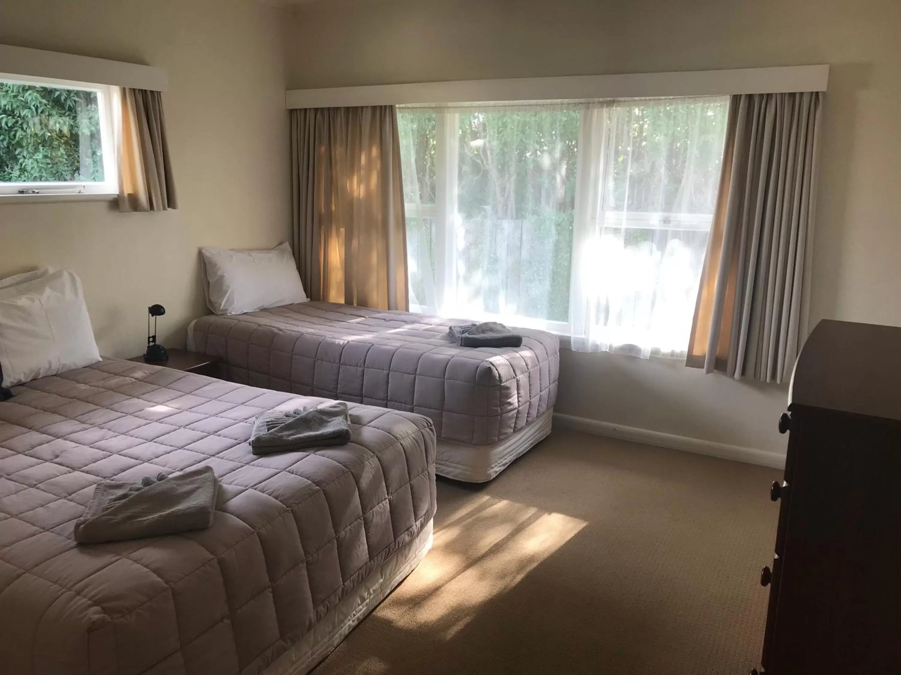 Bed in Tudor Lodge Motel