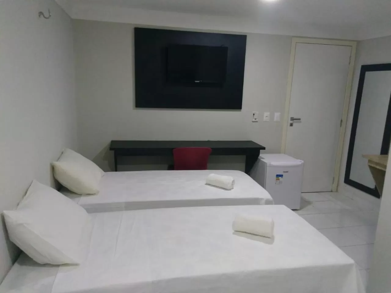 Communal lounge/ TV room, Bed in Hotel Executivo Boulevard