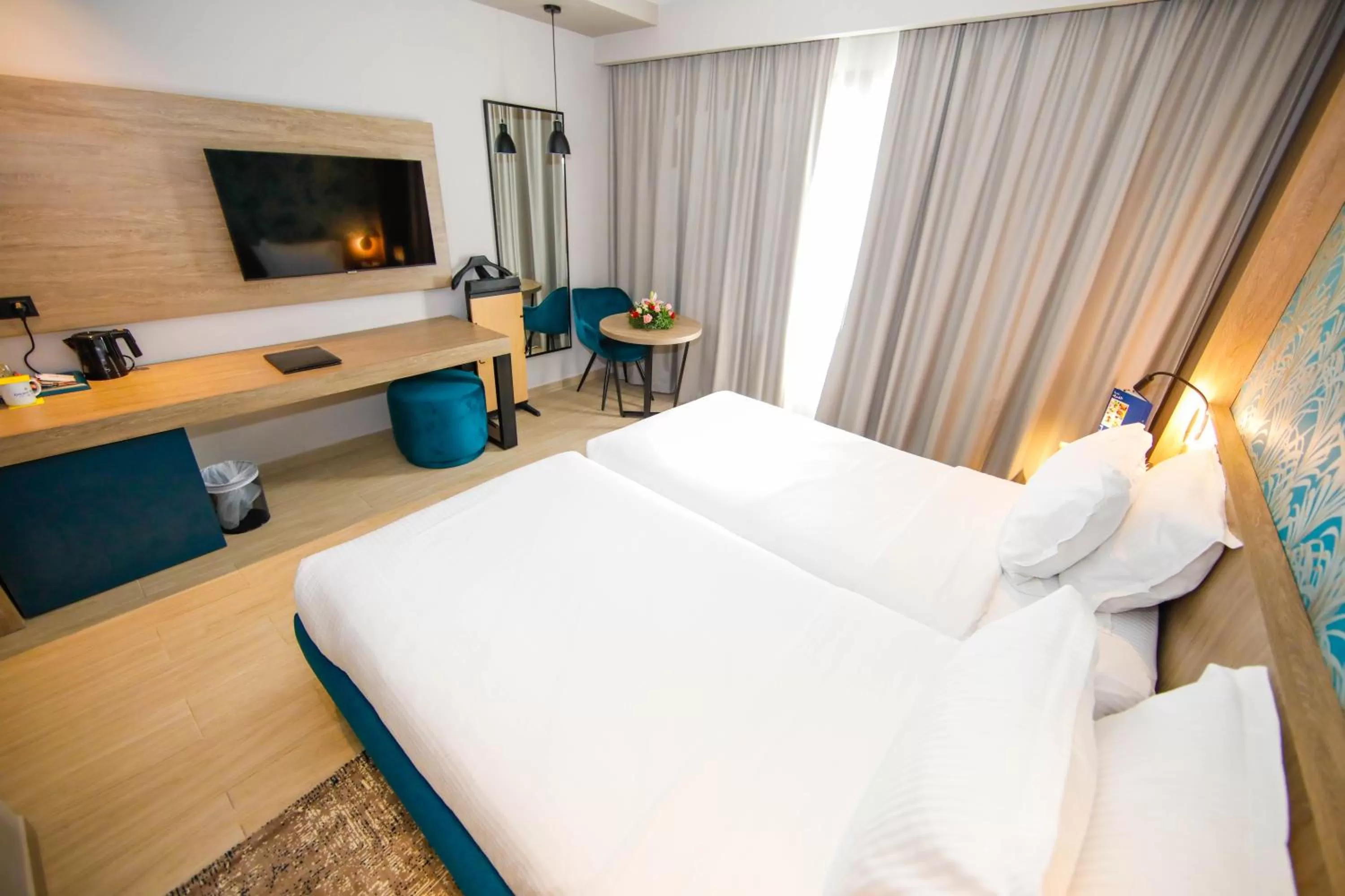 Photo of the whole room, Bed in Golden Tulip El Mechtel