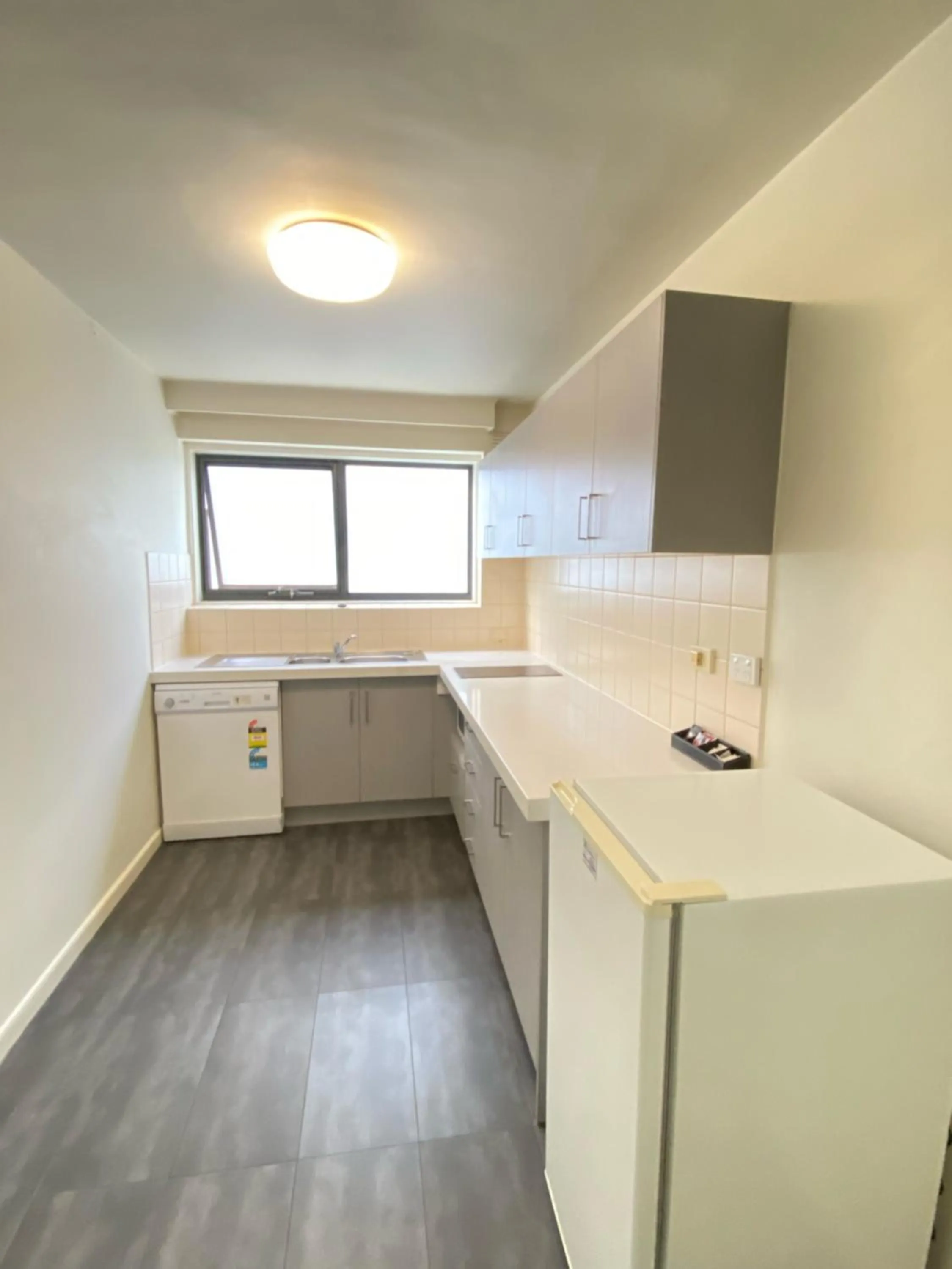 Kitchen or kitchenette in City Edge East Melbourne Apartment Hotel
