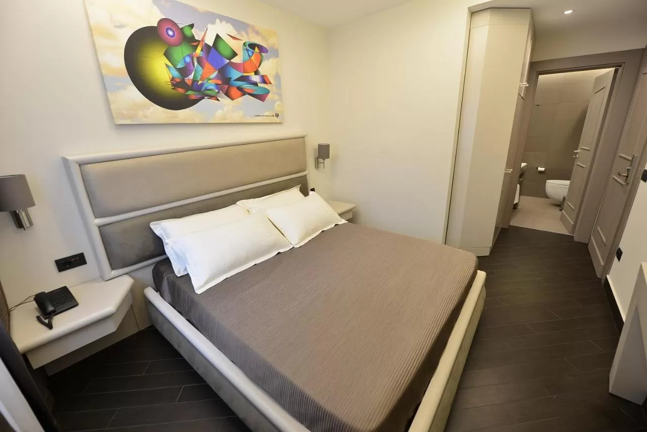 Bed in Petit Hotel Elita