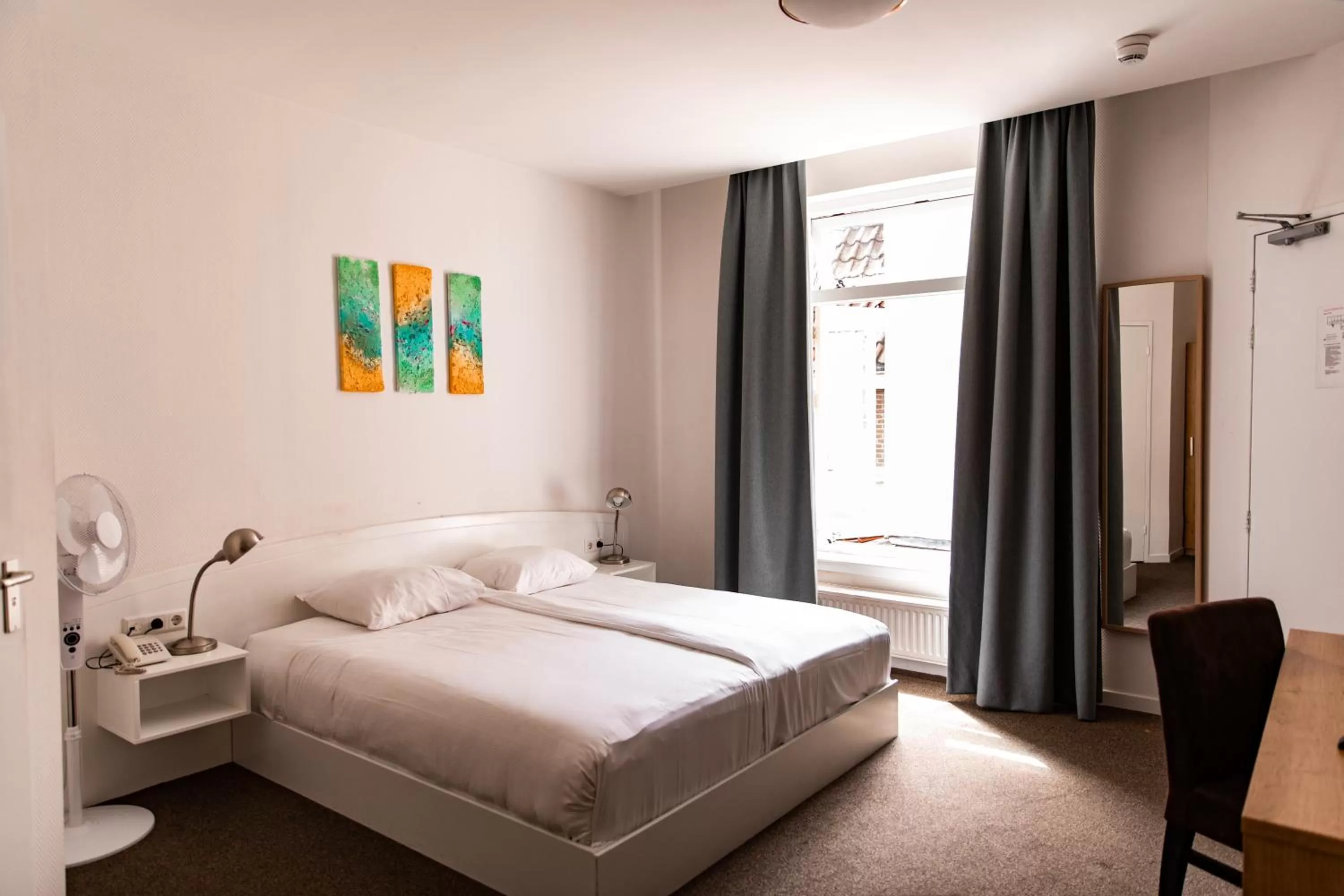 Bed in Ambassador City Centre Hotel