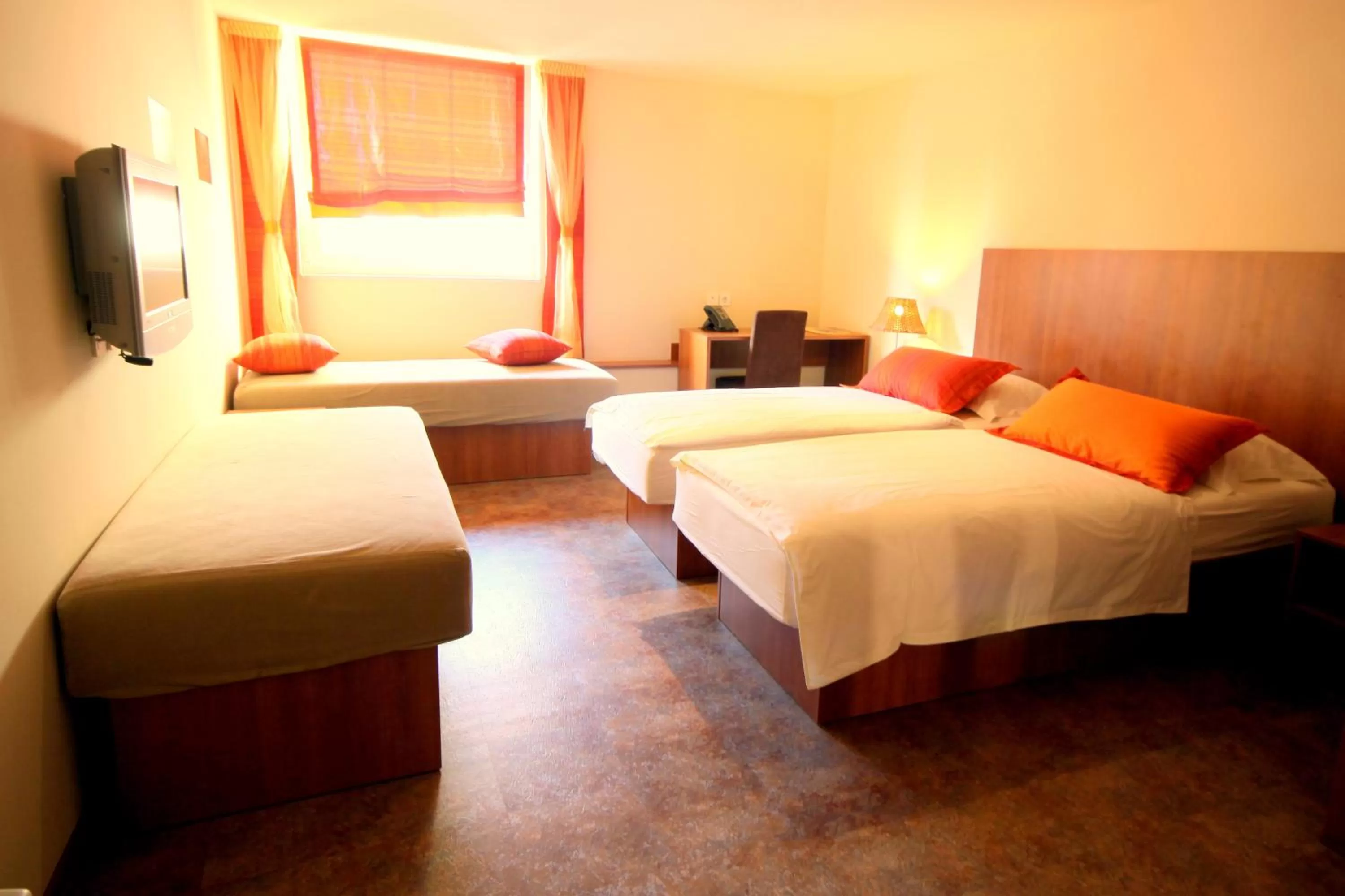 Bed in Ambient Hotel