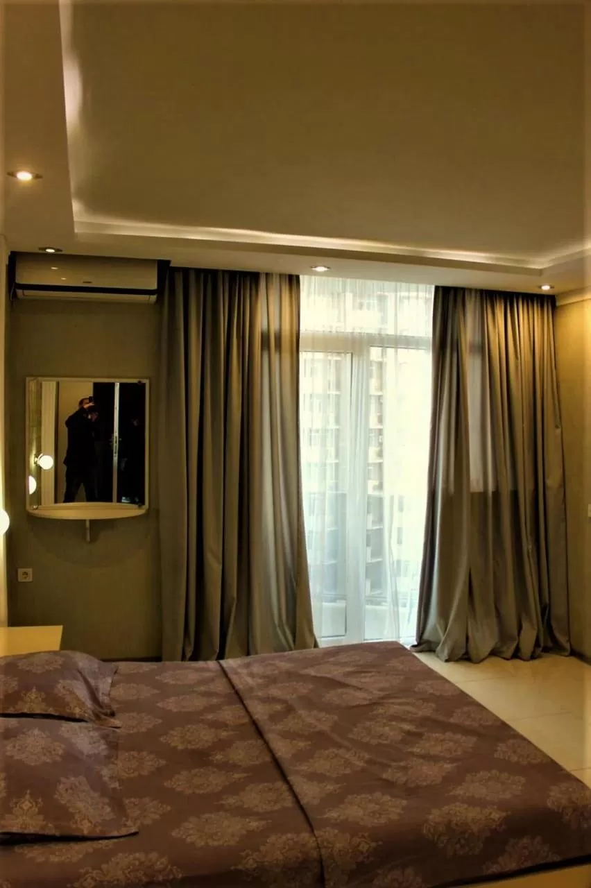 Bed in Orbi Lux Apartment