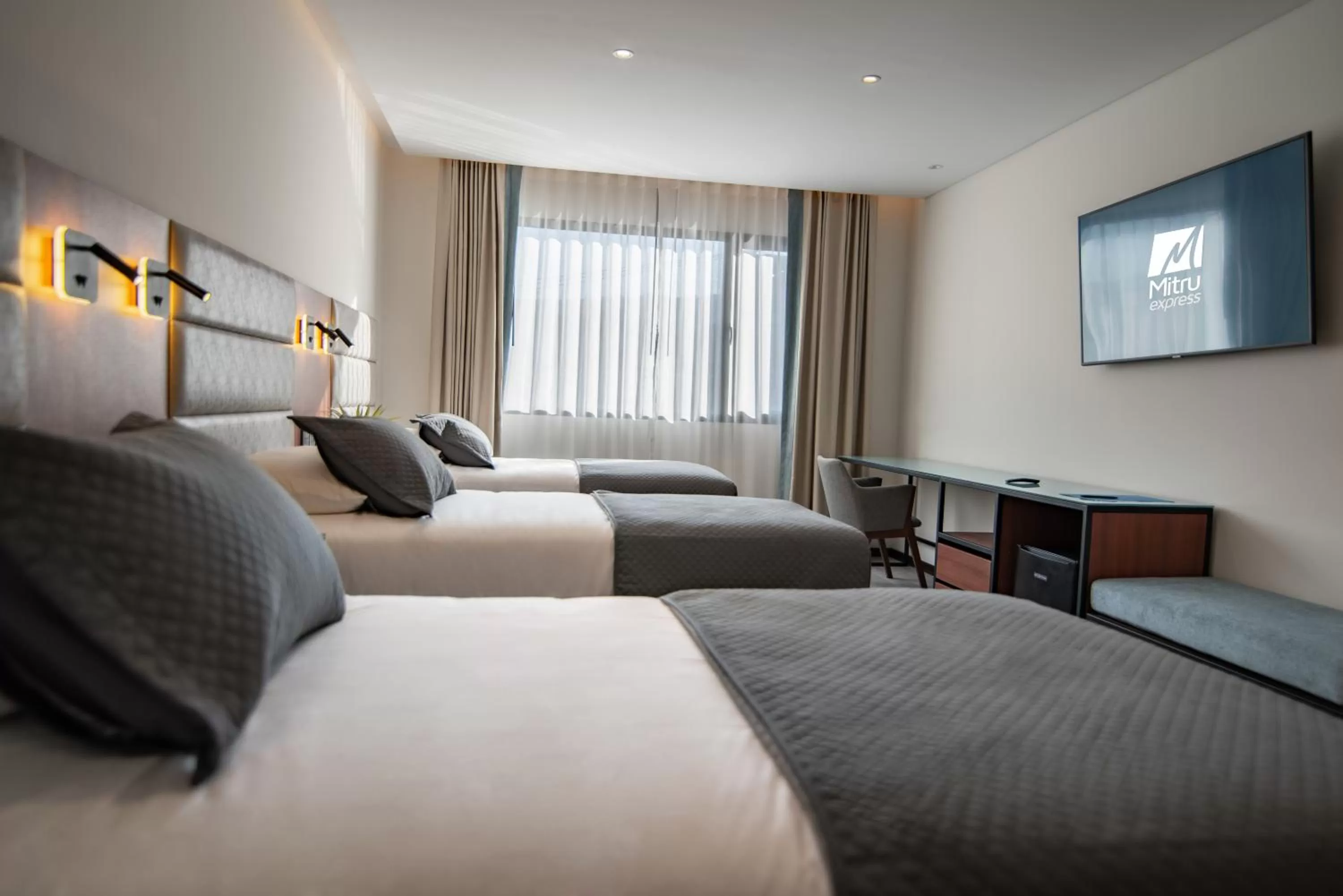 Bed in Mitru Express Hotel