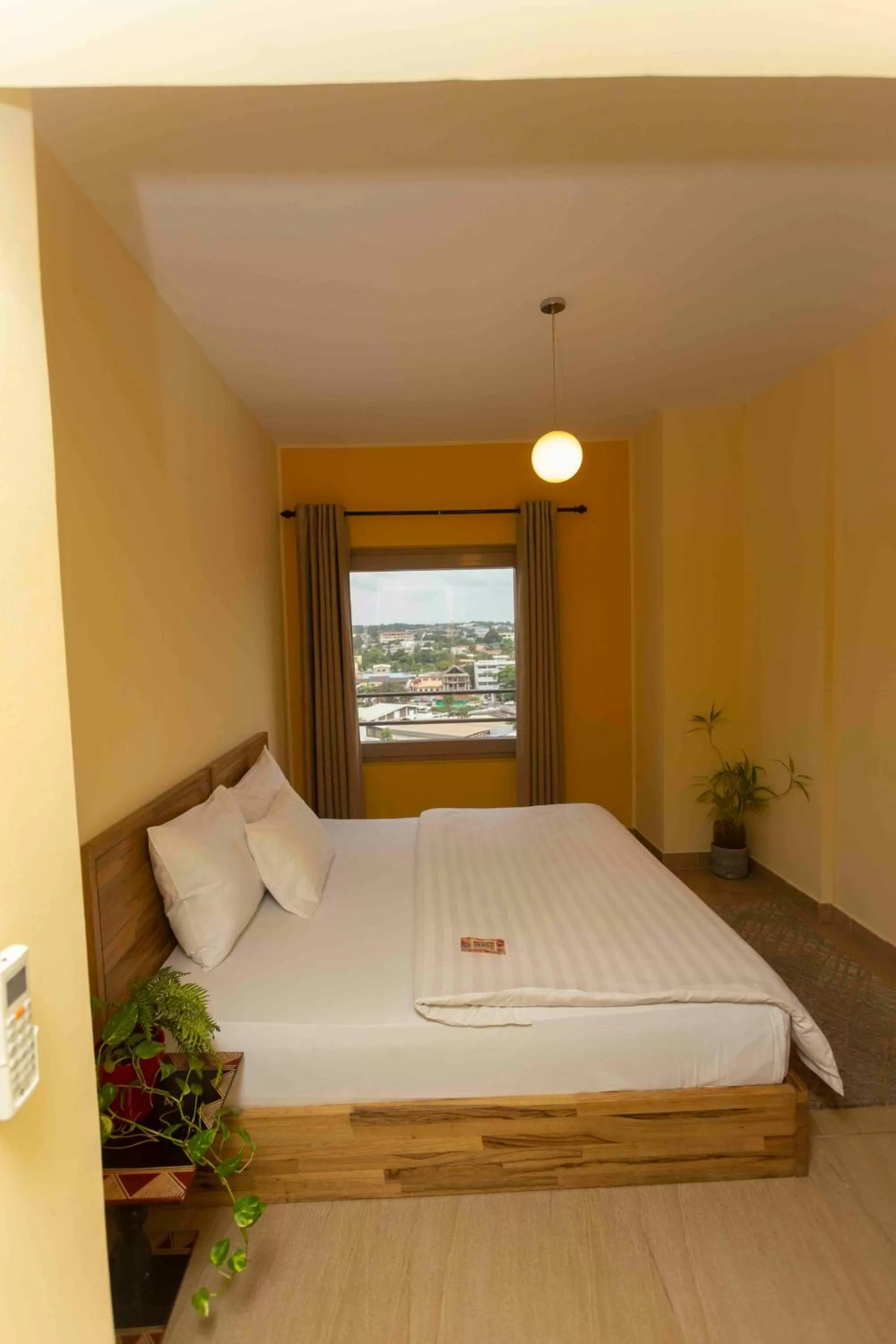 Bed in Roots Hotel Apartment