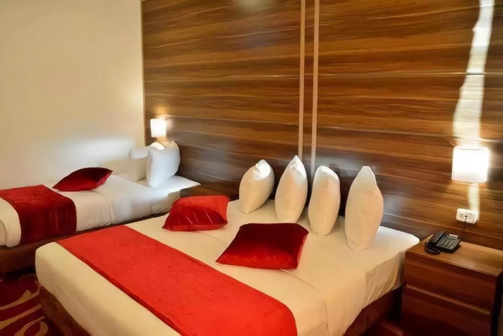 Bed in Spark Plaza Hotel