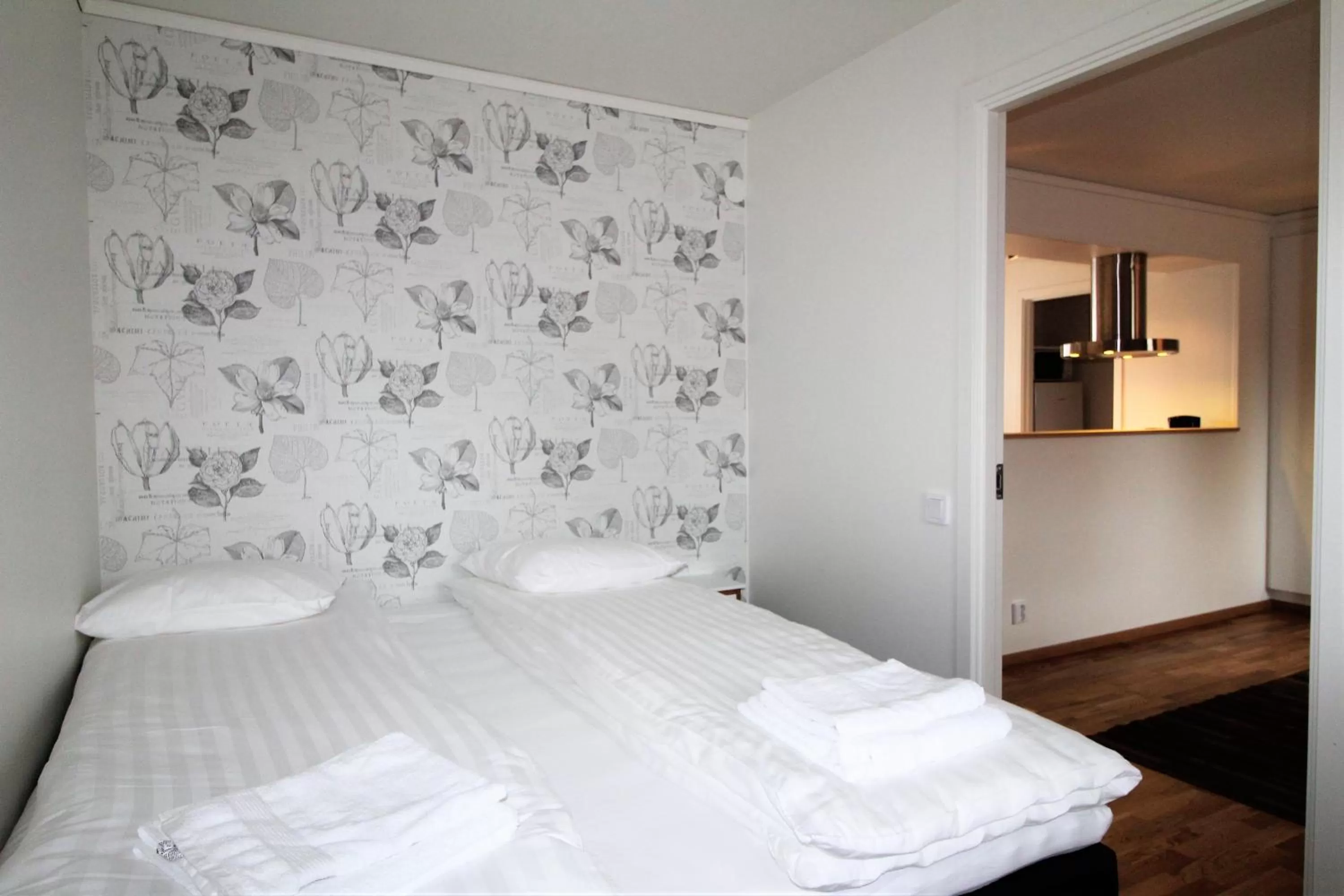 Bed in Easy Livin' Apartment Hotel