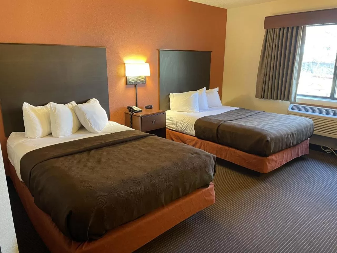 Bed in AmericInn by Wyndham Minocqua