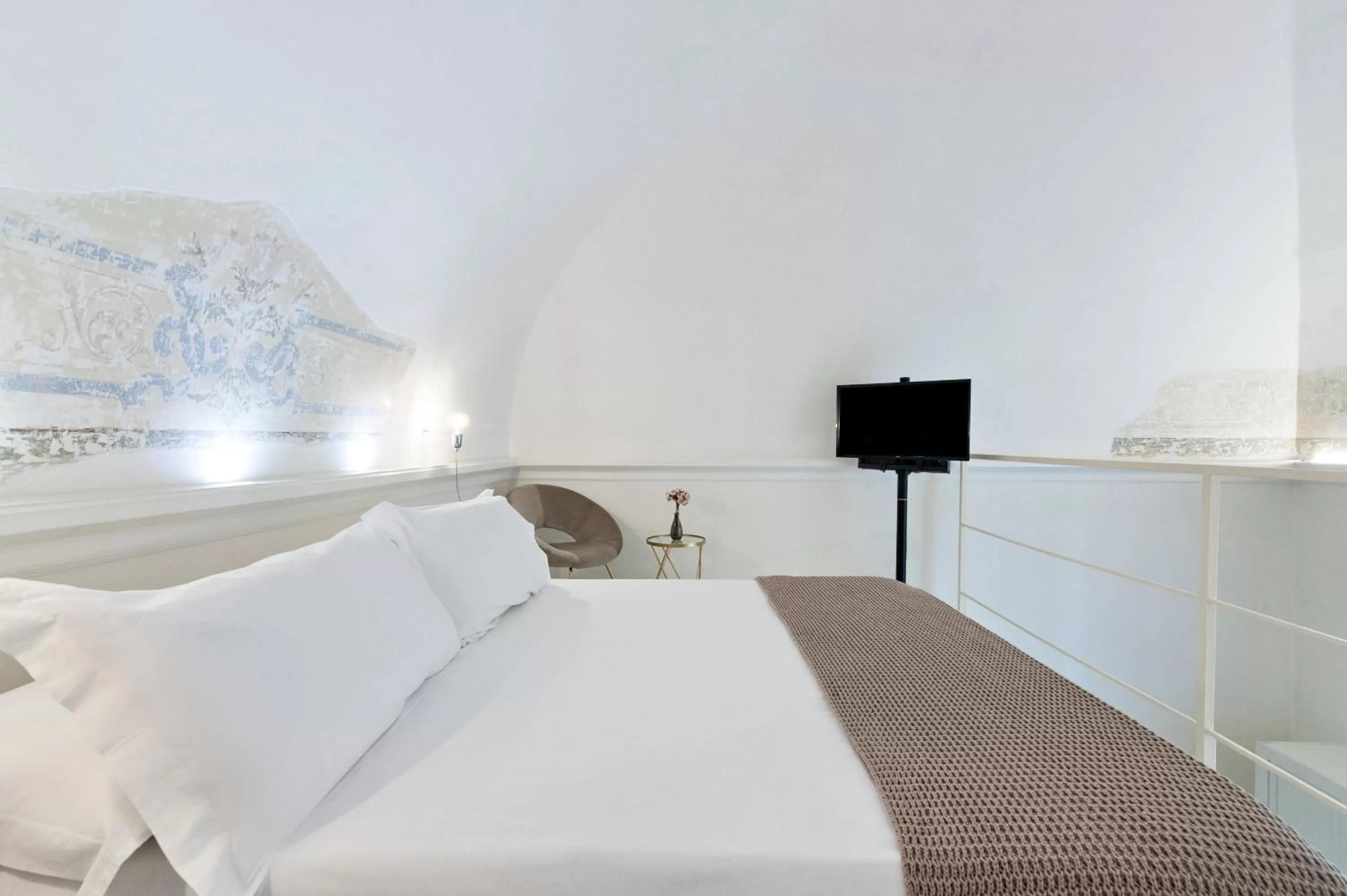 Bed in Casa di Lo Suites