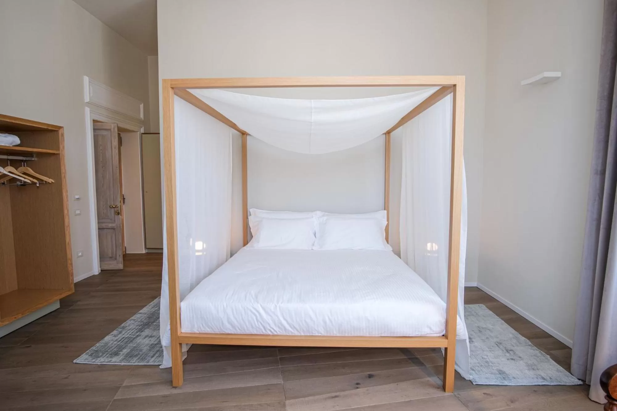 Bed in Dimora de Matera Luxury Suites