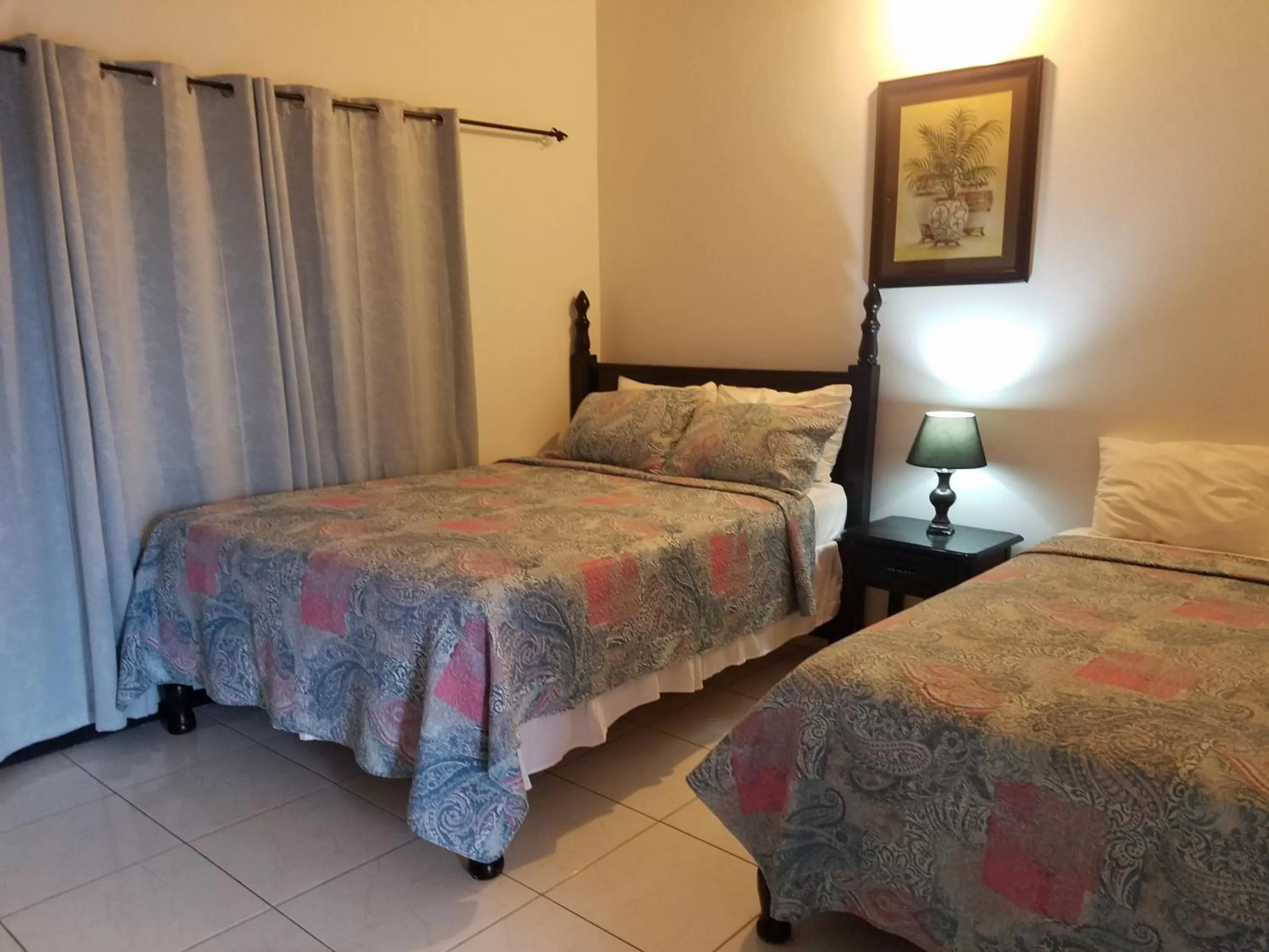 Bed in Roots Cafe Rooms