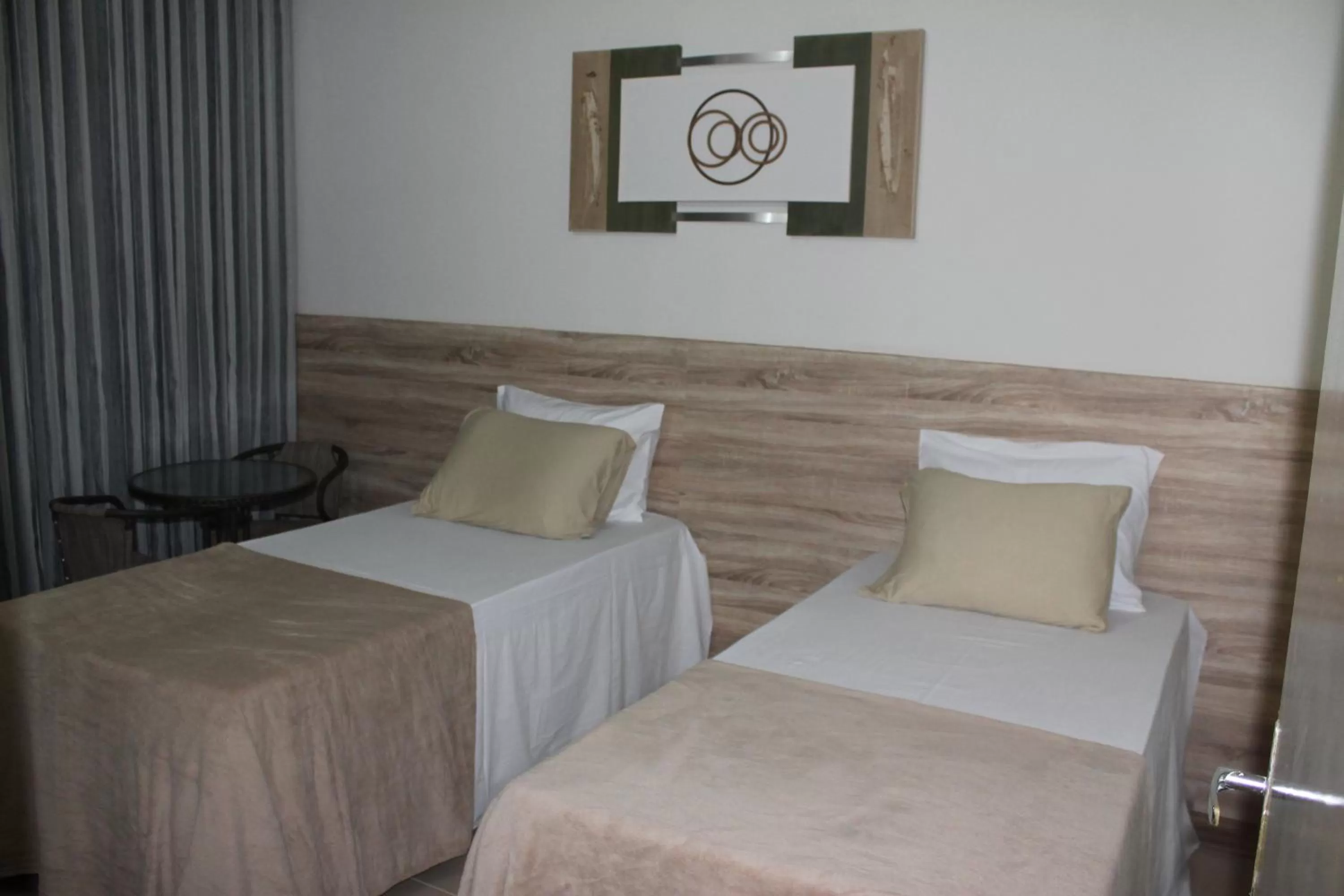 Bed in Pousada Das Palmeiras