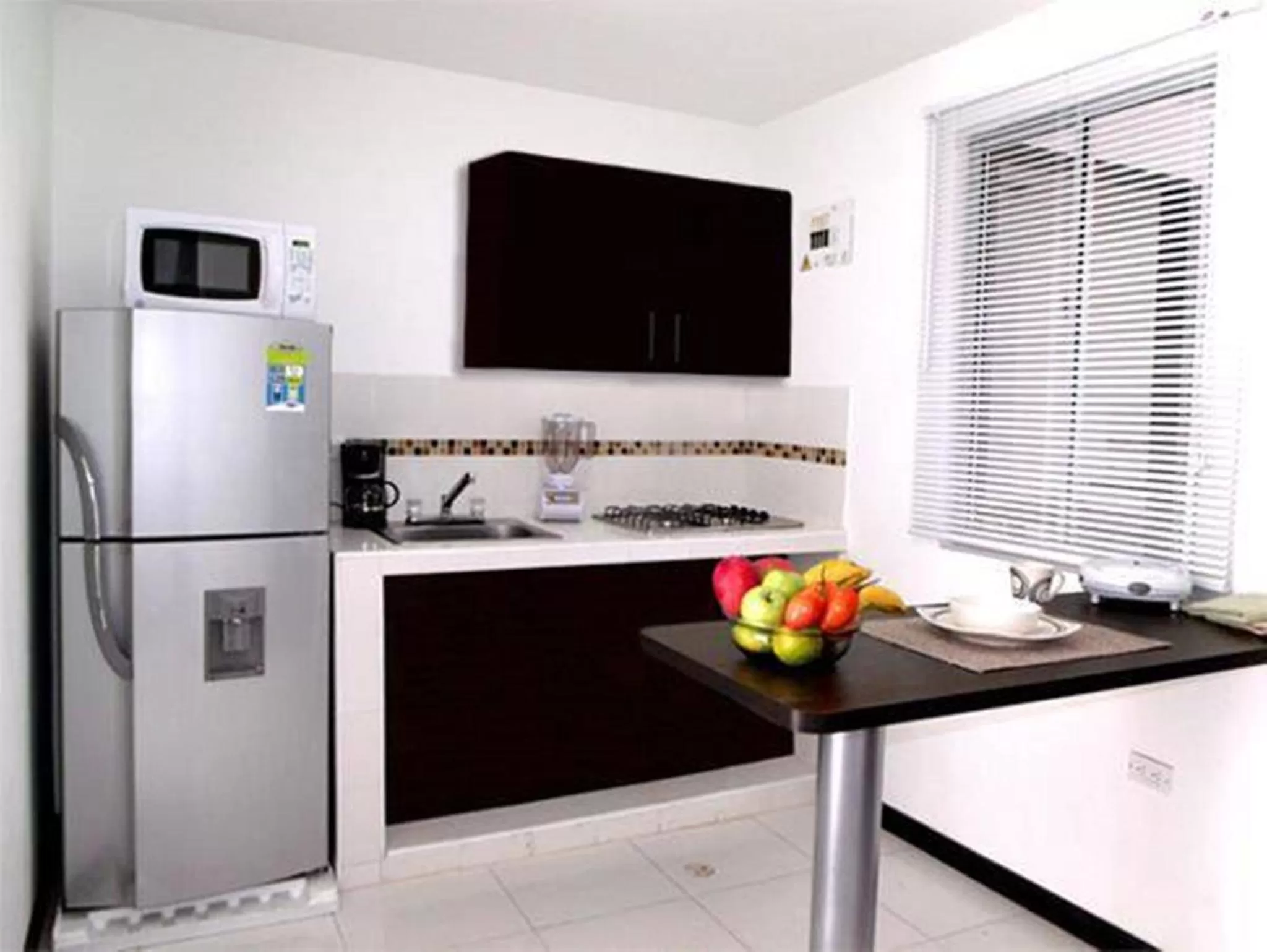 Kitchen or kitchenette in Apartasuites San Marcos