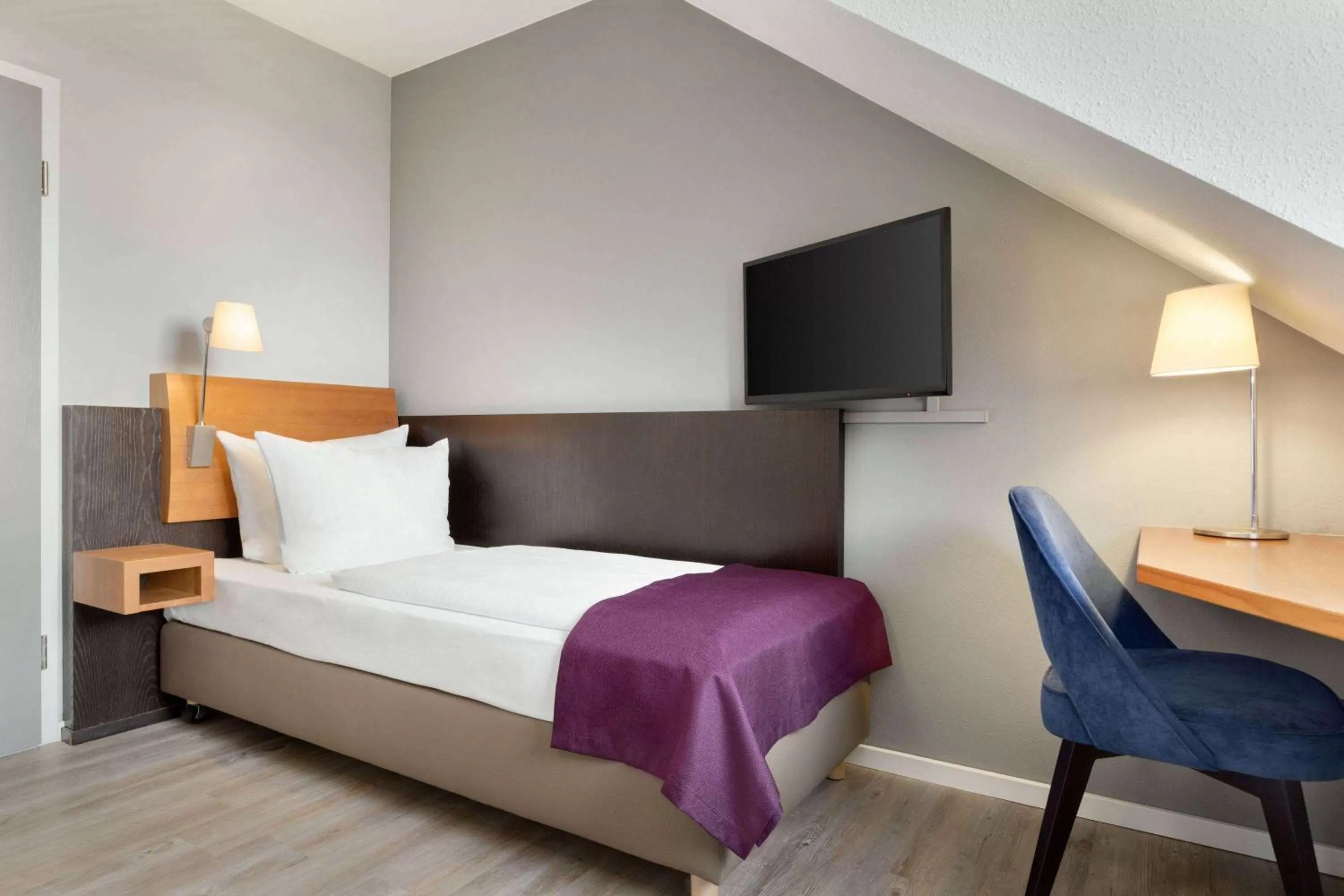 Photo of the whole room, Bed in Ramada by Wyndham München Airport