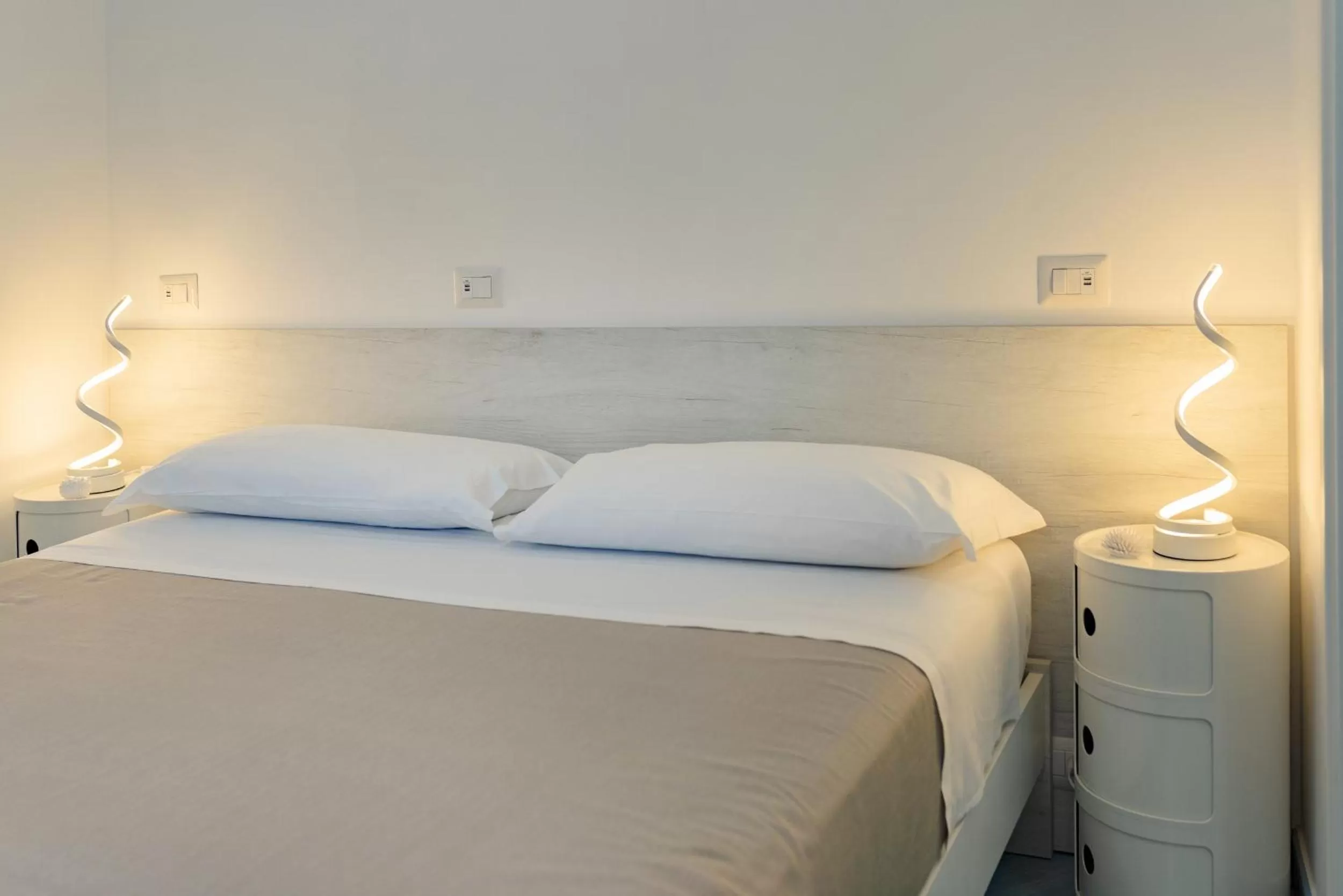 Bed in Poseidonia Rooms