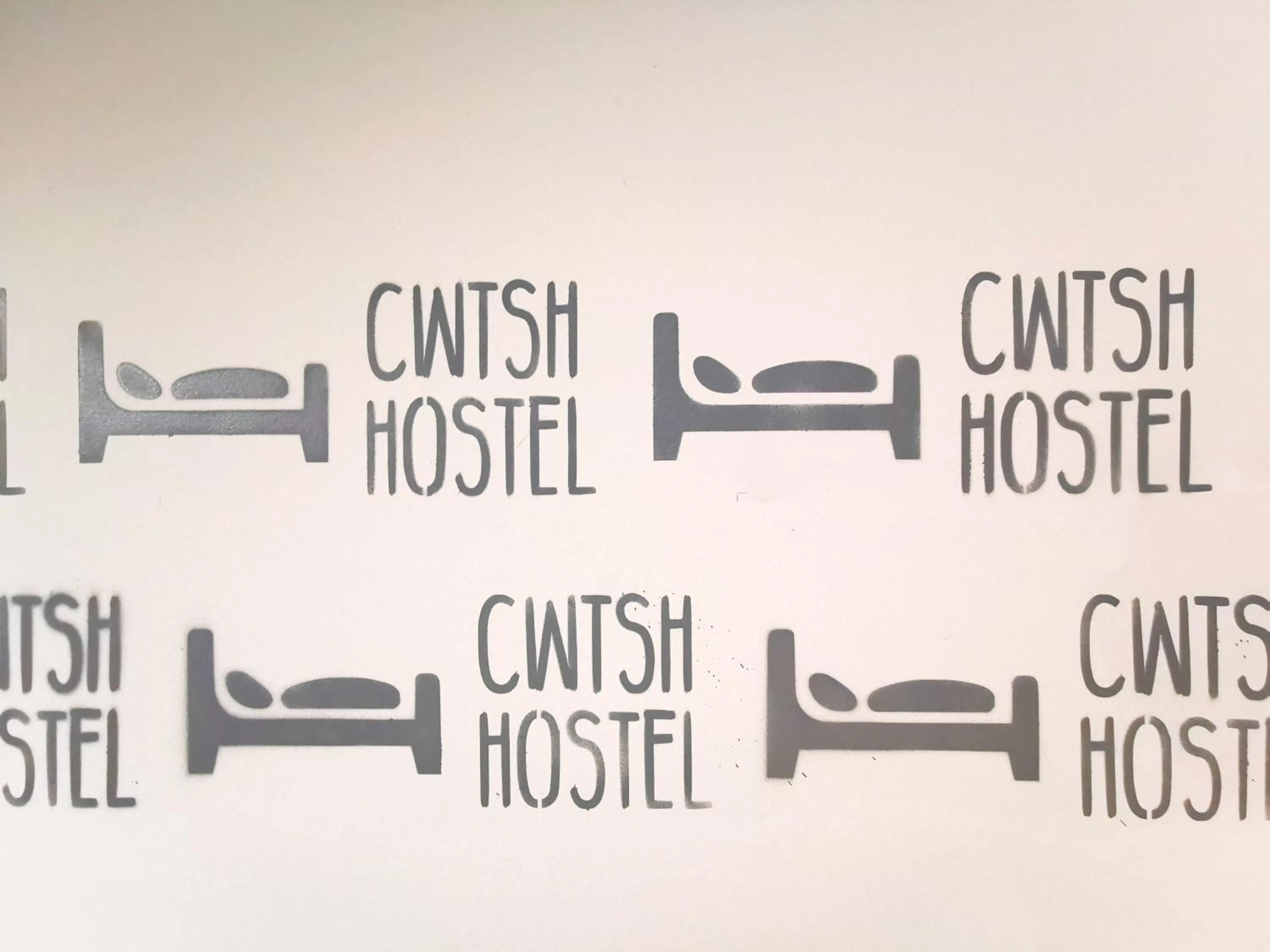 Property logo or sign in Cwtsh Hostel