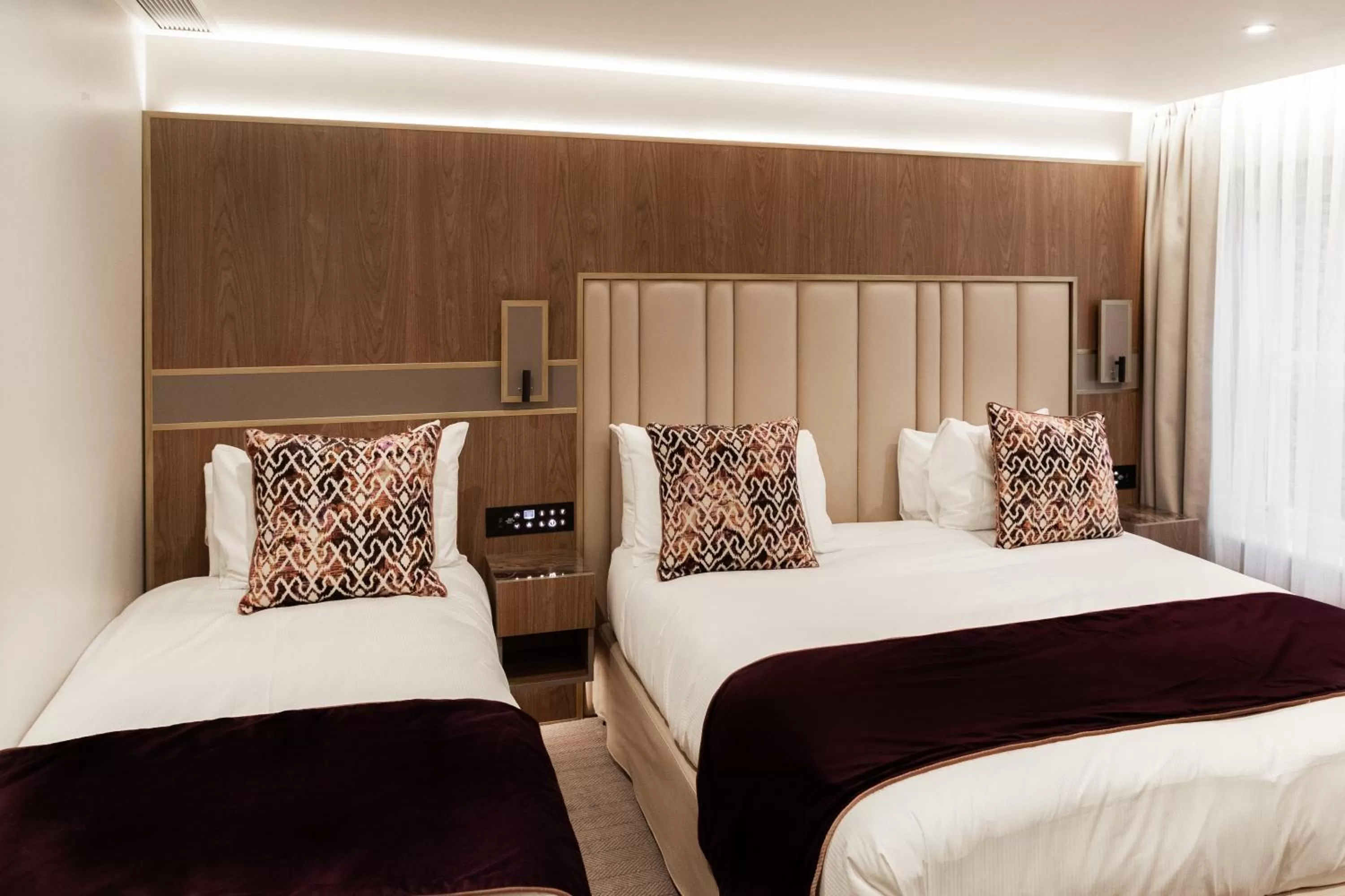 Bed in Merit Kensington Hotel