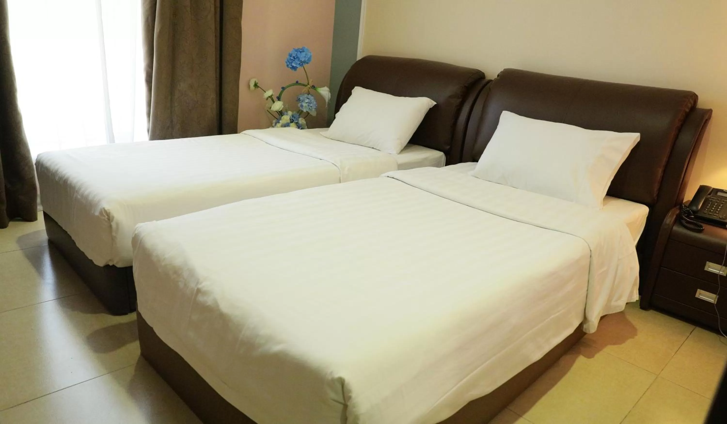 Bed in Laguna Hotel Suites