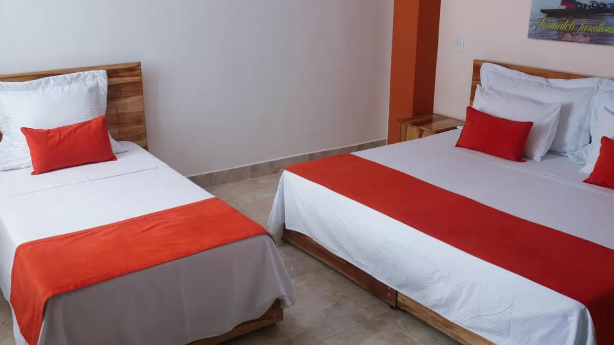 Bed in Kamaleb Farallones Hotel