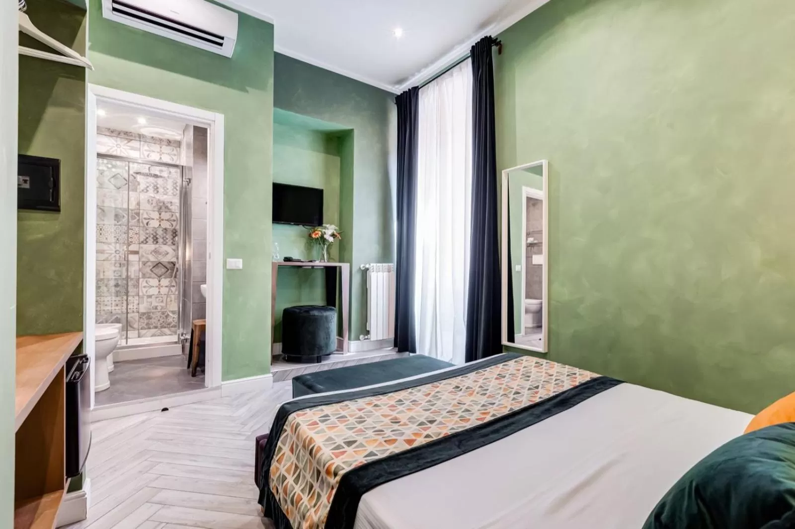 Bed in Ripetta Deluxe Suites