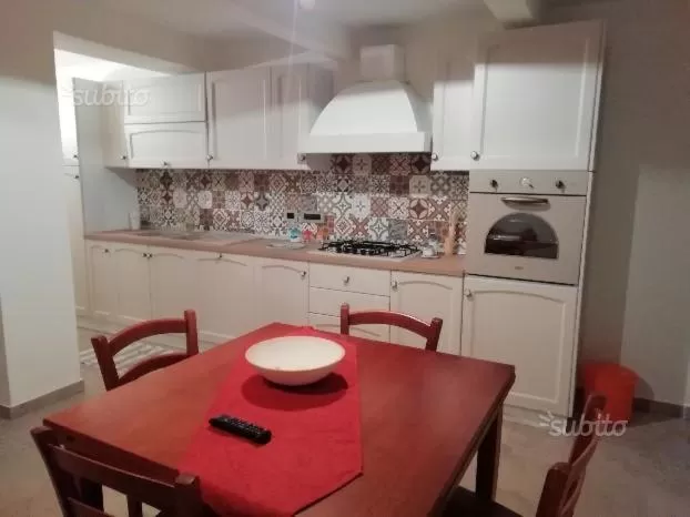 Kitchen/Kitchenette in B&B Domus Palmi