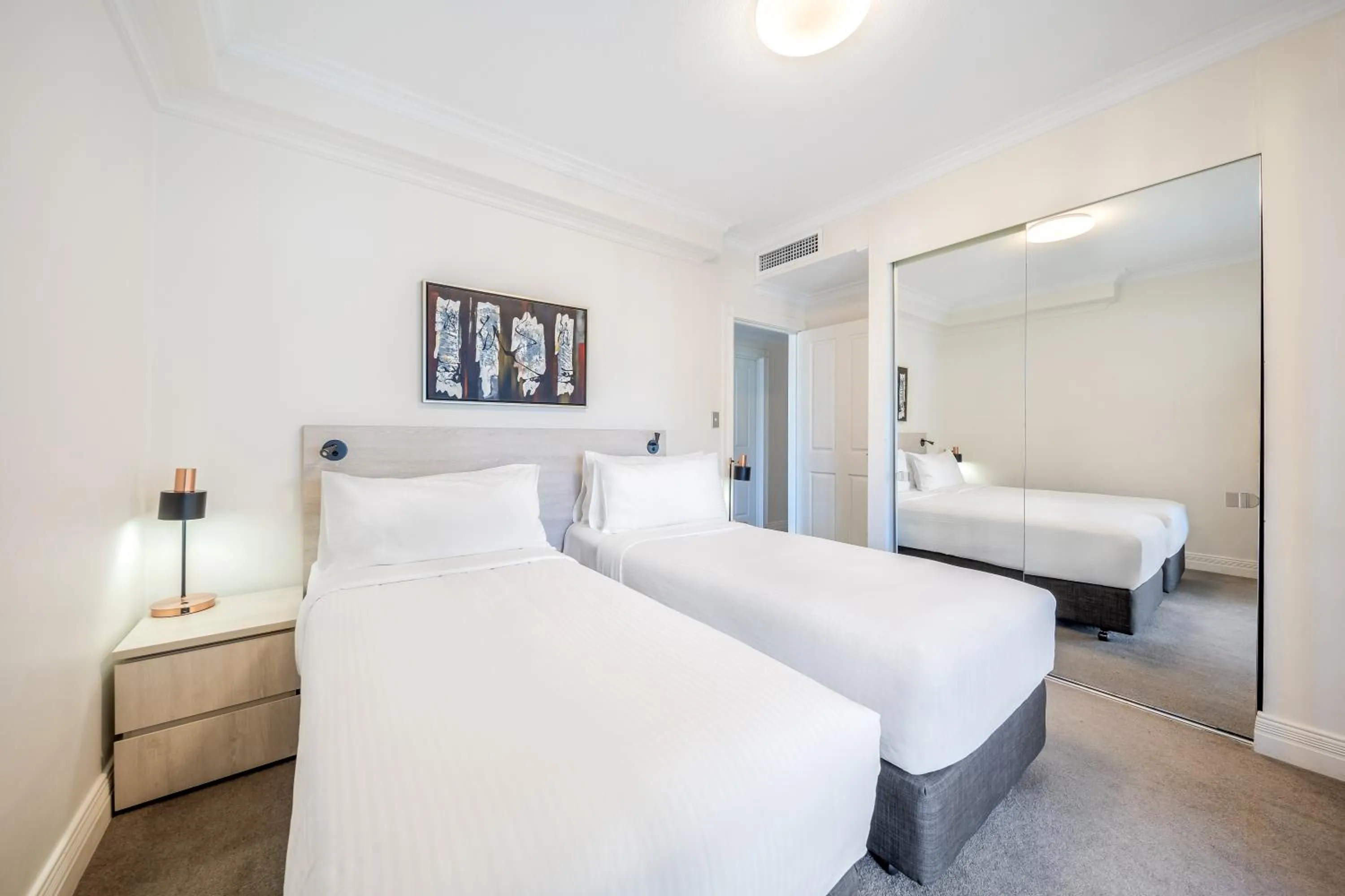 Bed in Oaks Sydney Castlereagh Suites
