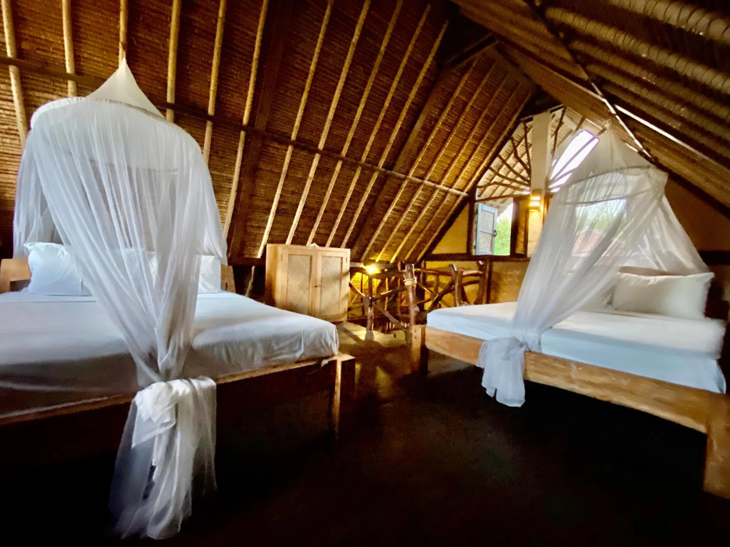 Bed in Flower Bud Bungalow Balangan