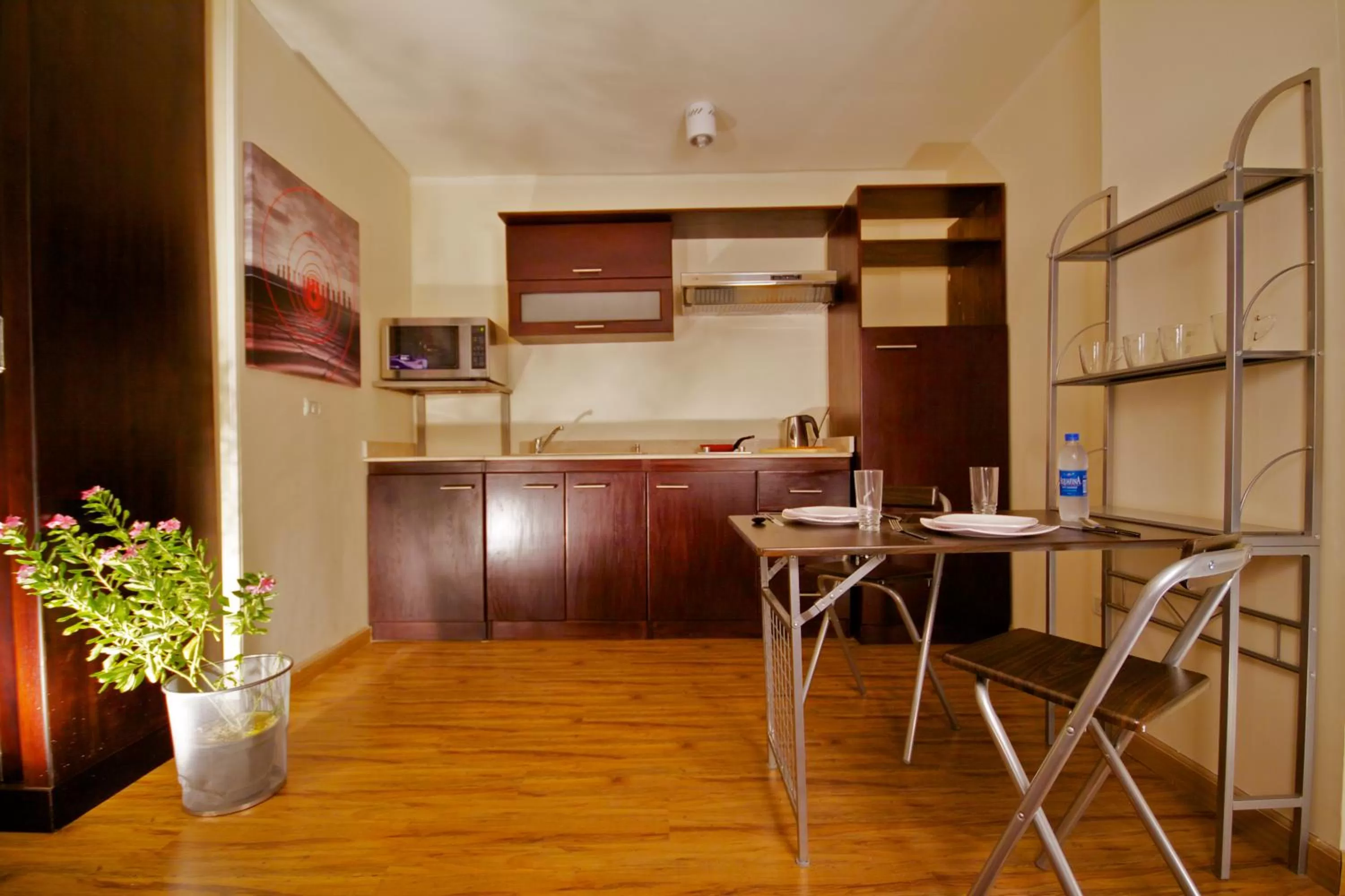 Kitchen or kitchenette in NewCity Hotel & Suites