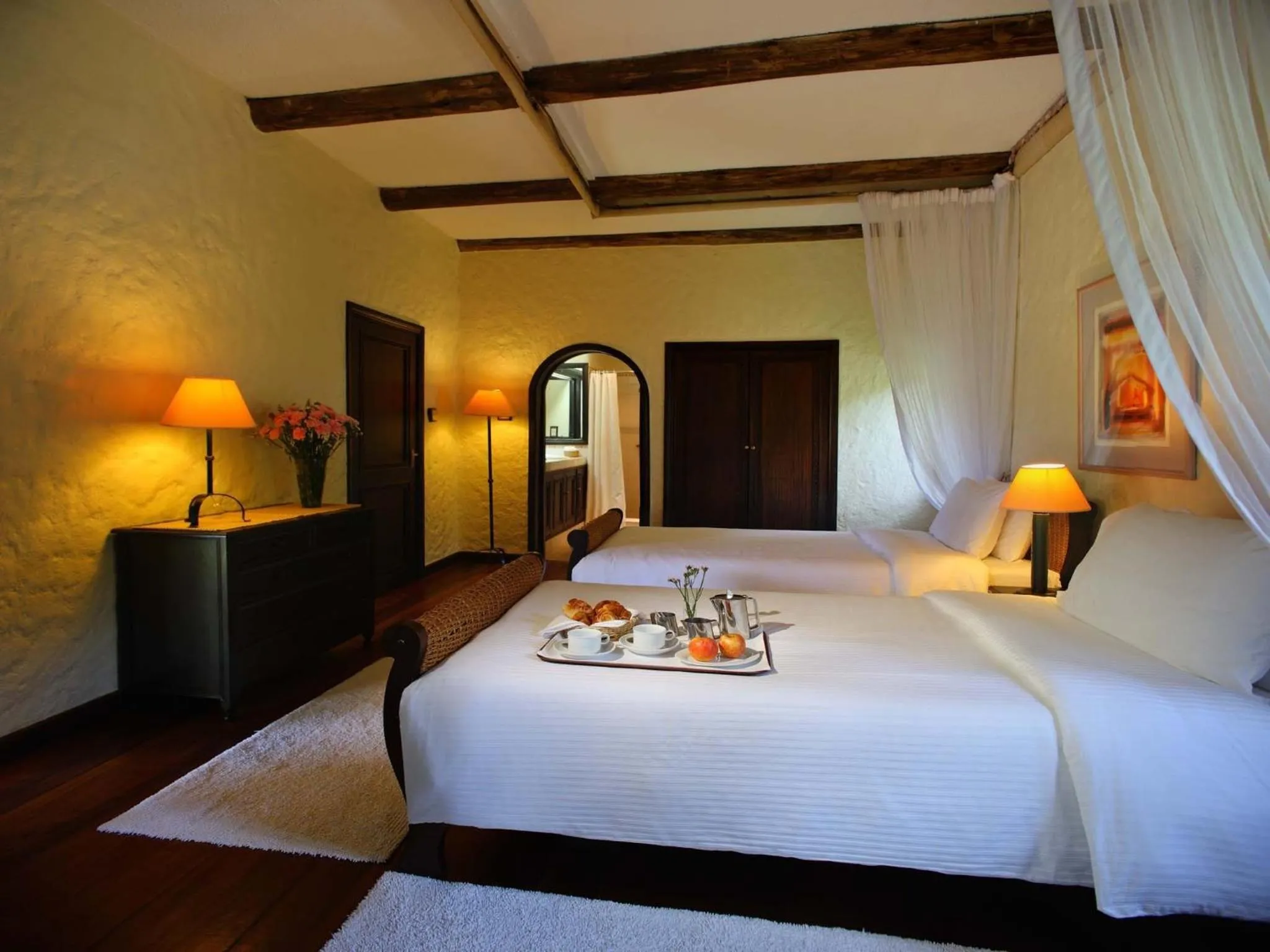 Bed in Sarova Lion Hill Game Lodge