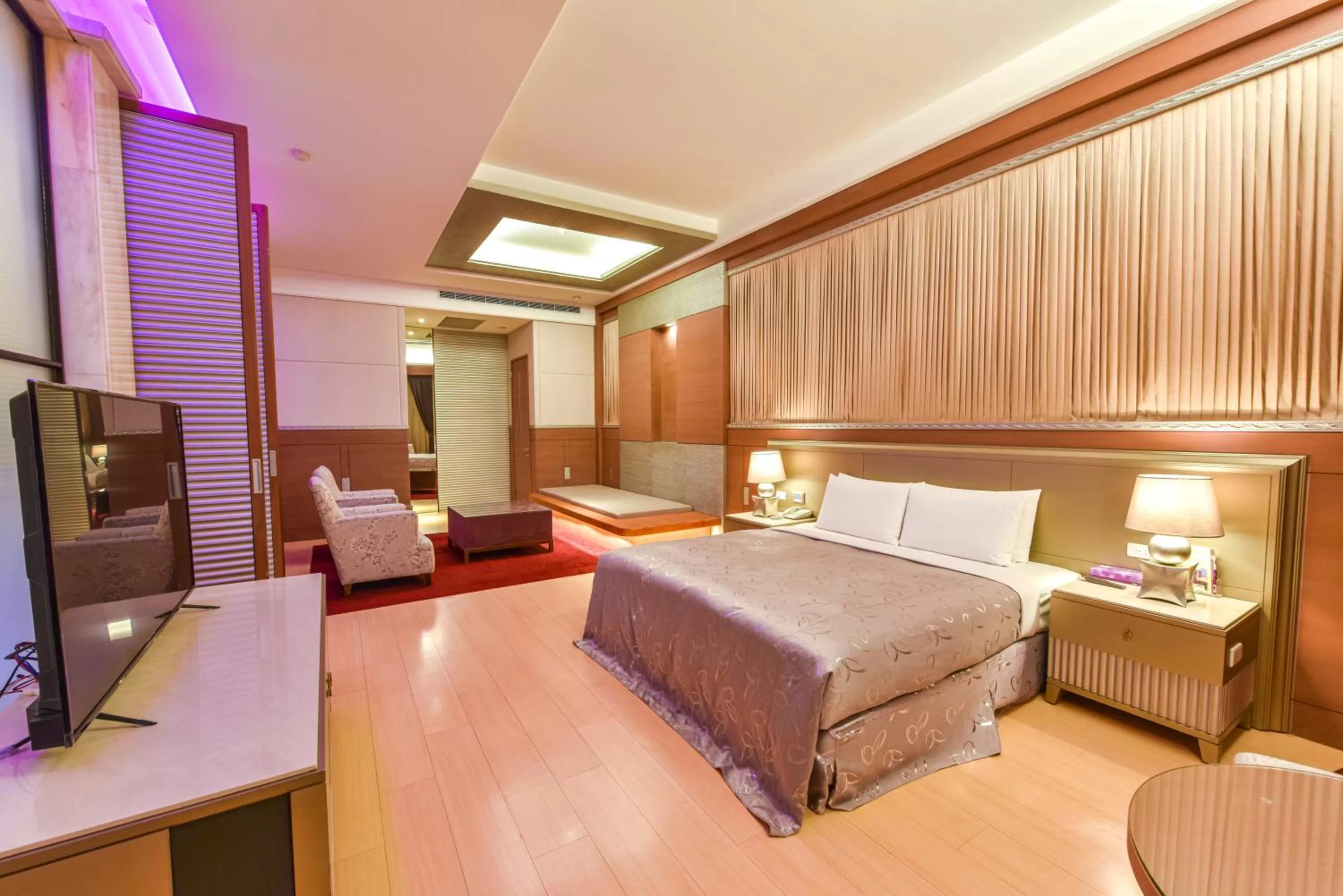 Bed in Purple Garden Motel