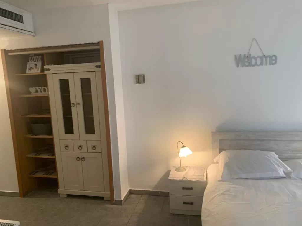 Bed in Raphael Apartments