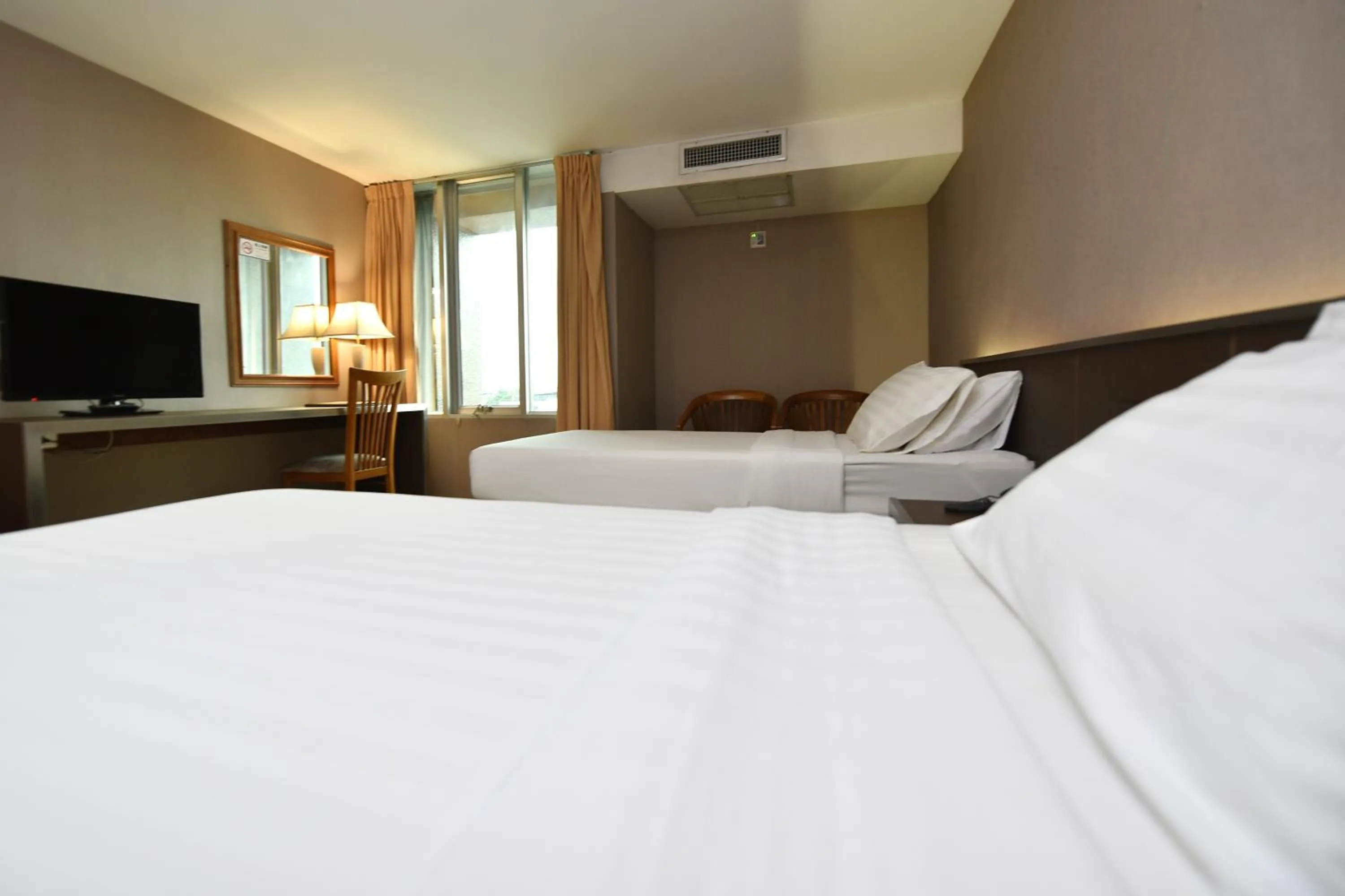 Bed in Bangkok City Suite