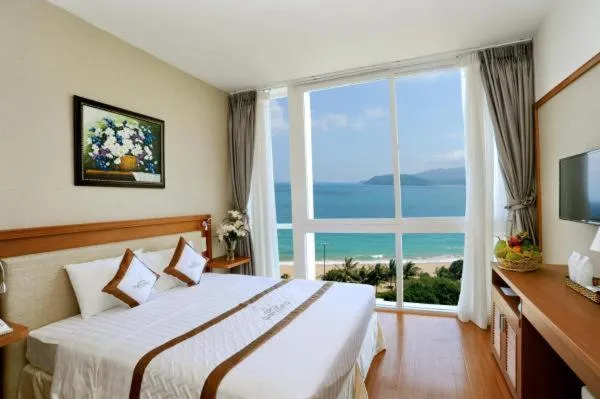 Bed in Dendro beachfront Hotel