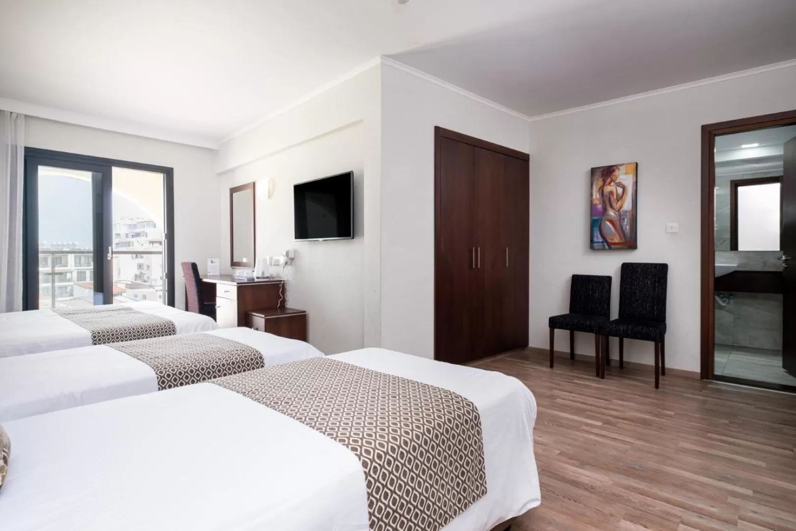 Bed in Livadhiotis City Hotel