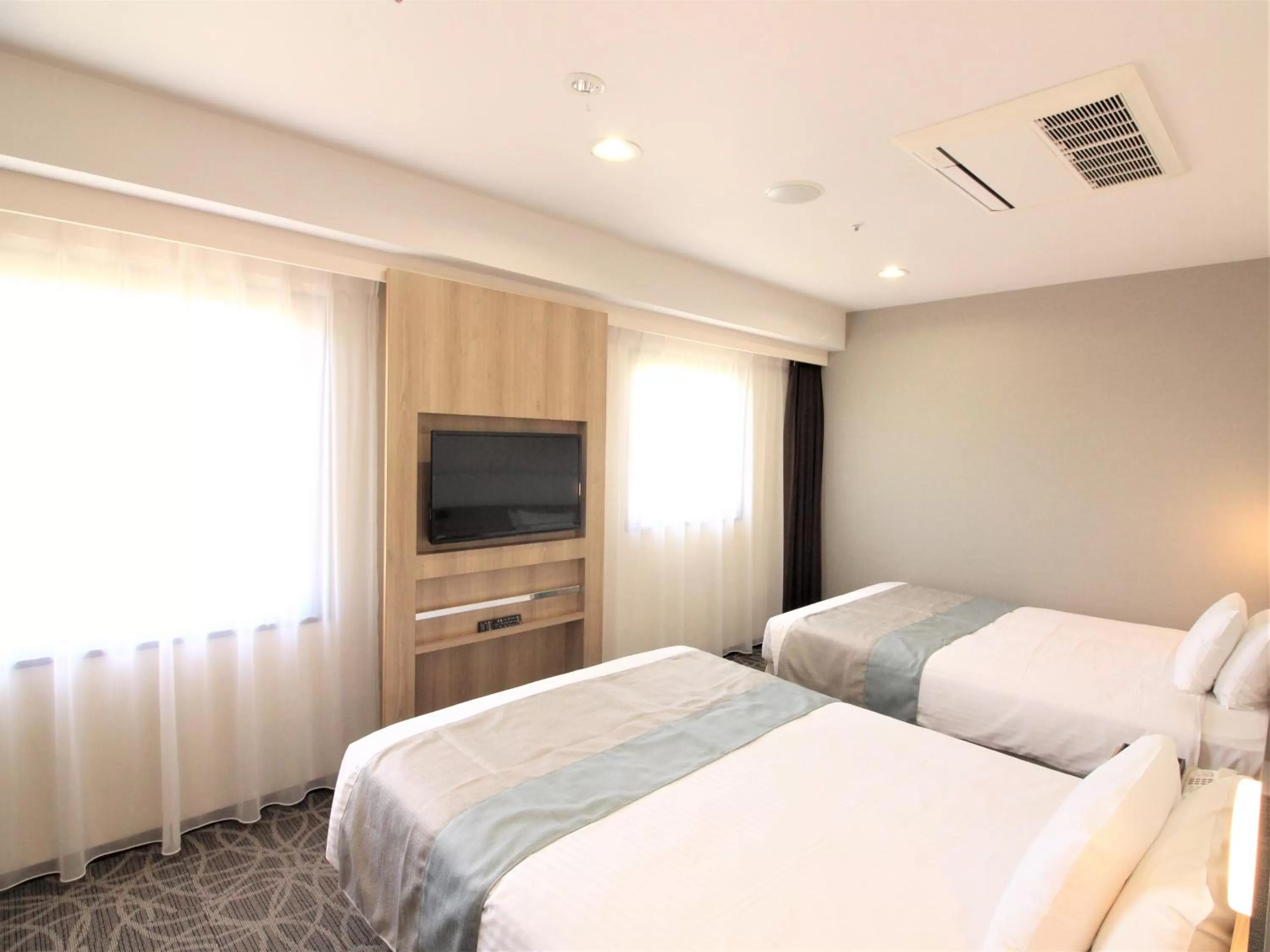Bedroom, Bed in Hotel Hokke Club Naha Shintoshin