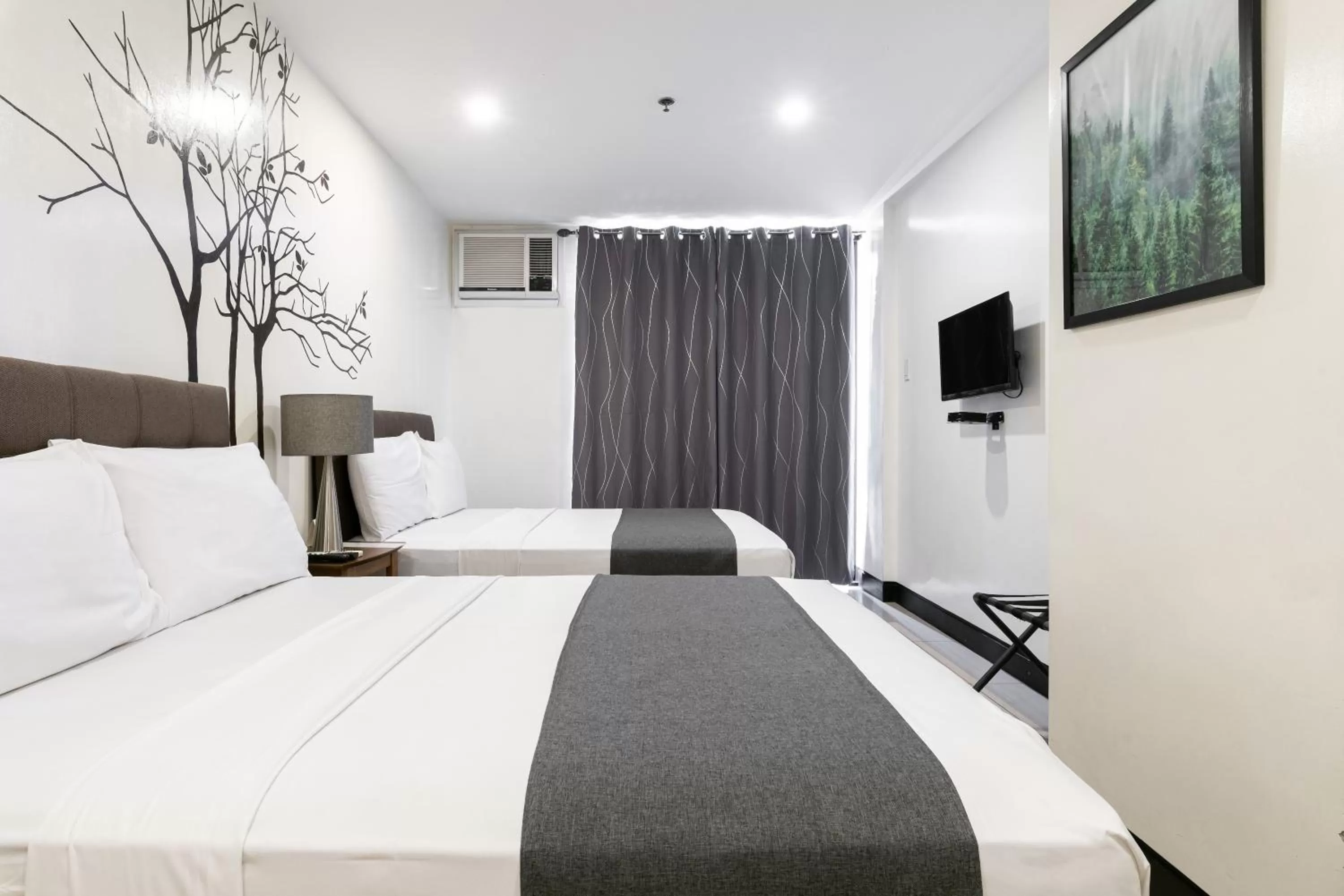 Bedroom, Bed in Artemis Place Makati Hotel